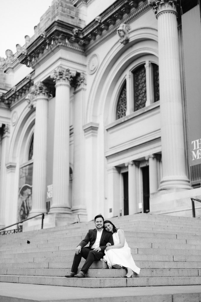 Couple has engagement photos taken as they sit on the steps of The Met in NYC Jenny Fu Photography