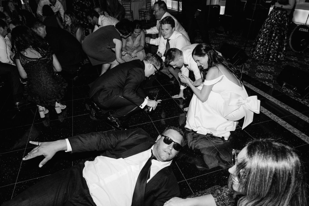Everybody "gets down" on the dance floor during a fun and memorable wedding at Le Chateau in South Salem NY with Jenny Fu Studio