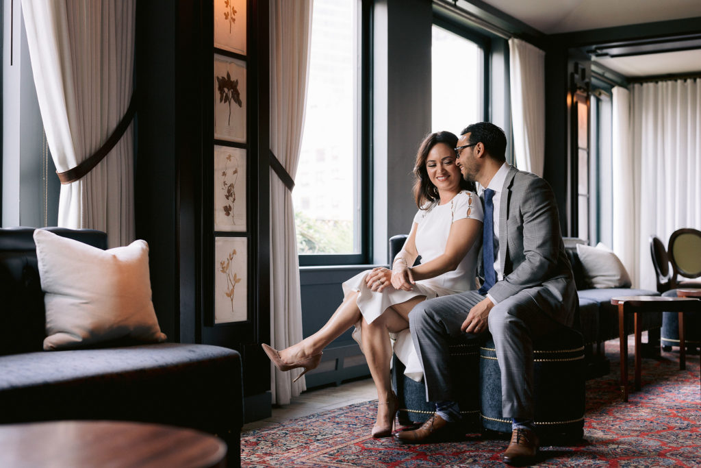 newlywed couple sneaks in some quiet time in the lobby of the Nomad Hotel in New York City. Photos by Jenny Fu Photography.