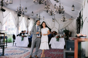 A husband and wife celebrate with their guests at their small wedding reception inside the Nomad Hotel with Jenny Fu Studios