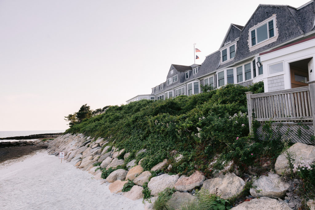 oceanside view of cape cod residences on a clear morning