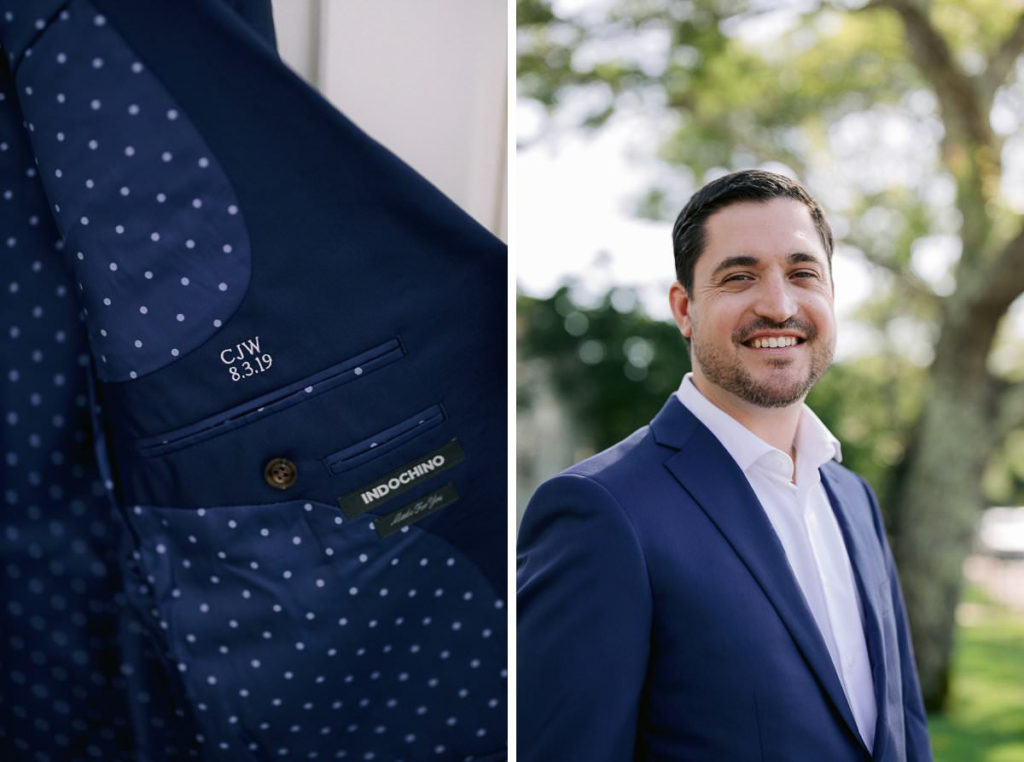 close up of a navy tie with white polka dots and a the groom wearing a navy suit and smiling outside