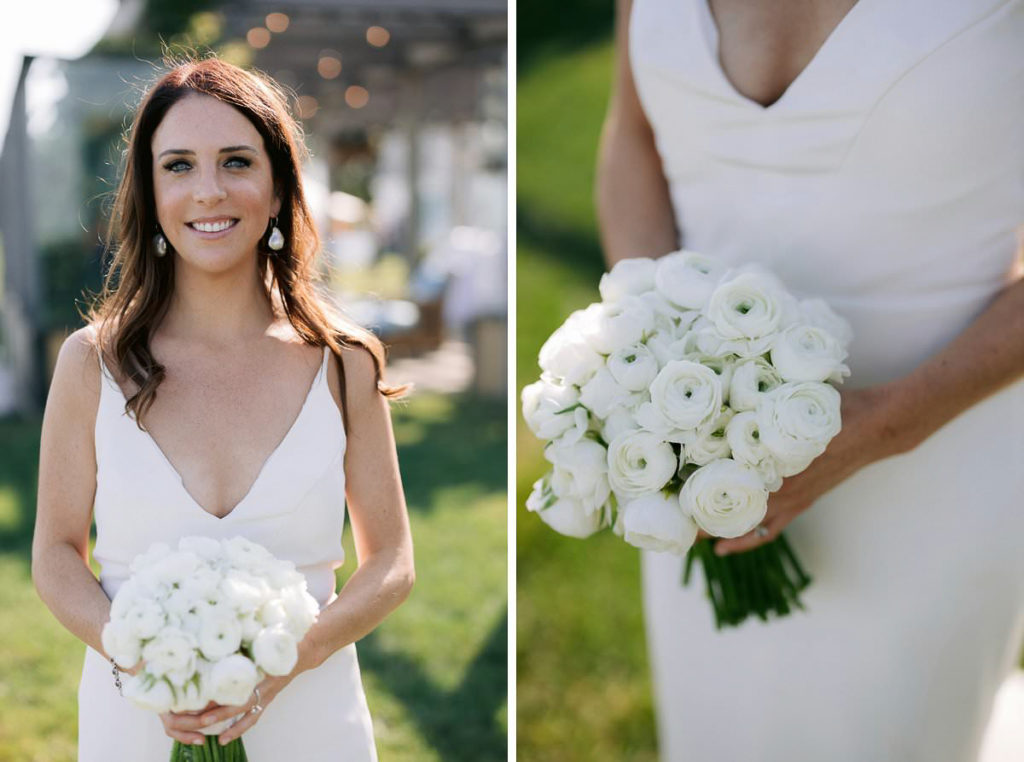 common bridal portrait of brunette bride of about 30 posing with her white rose bouquet and smiling
