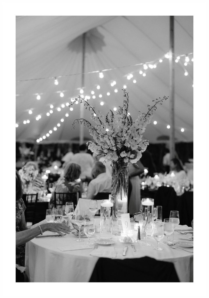 black and white image of floral centerpieces at a cape cod wedding reception