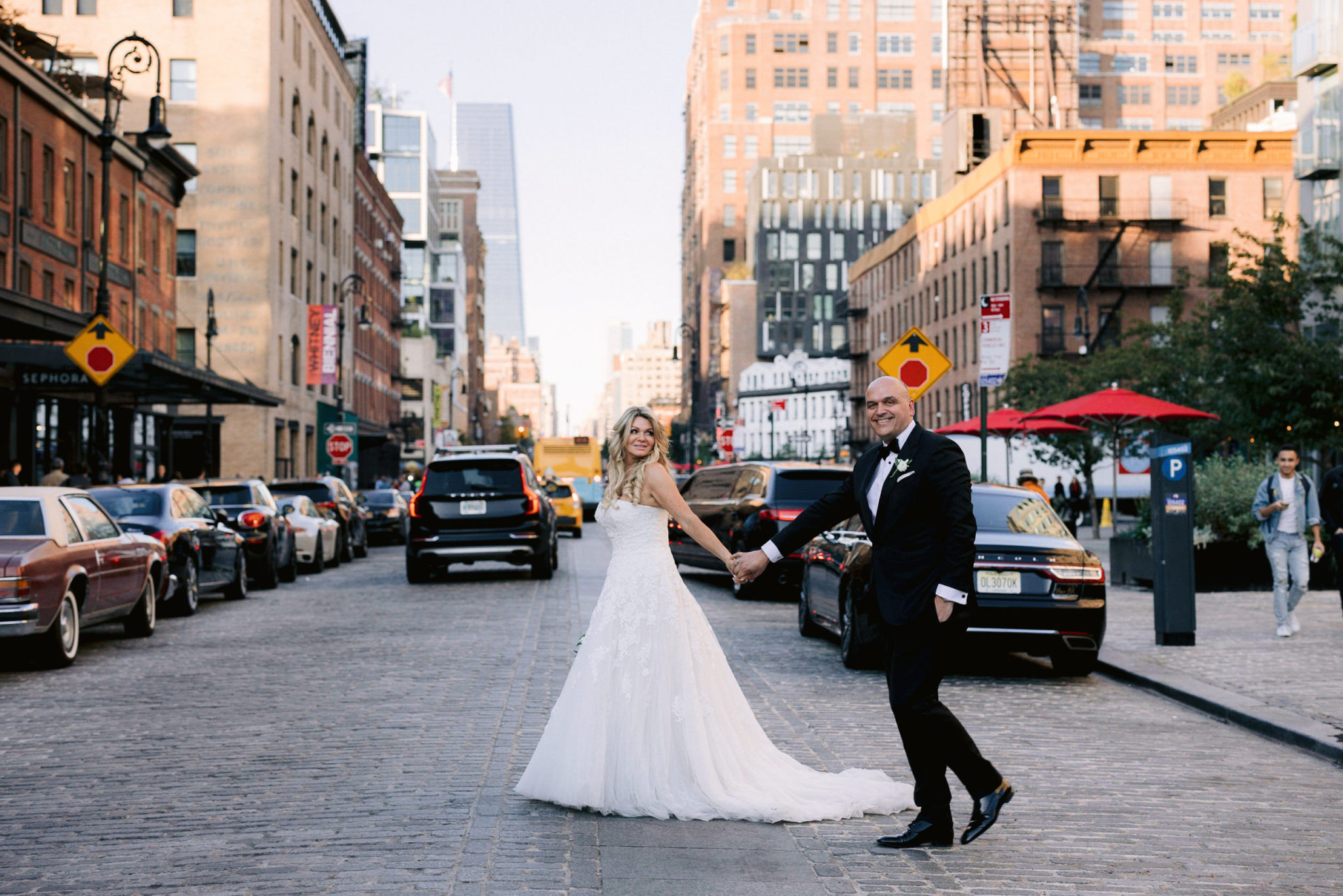 Husband and wife crossing a busy NYC street
