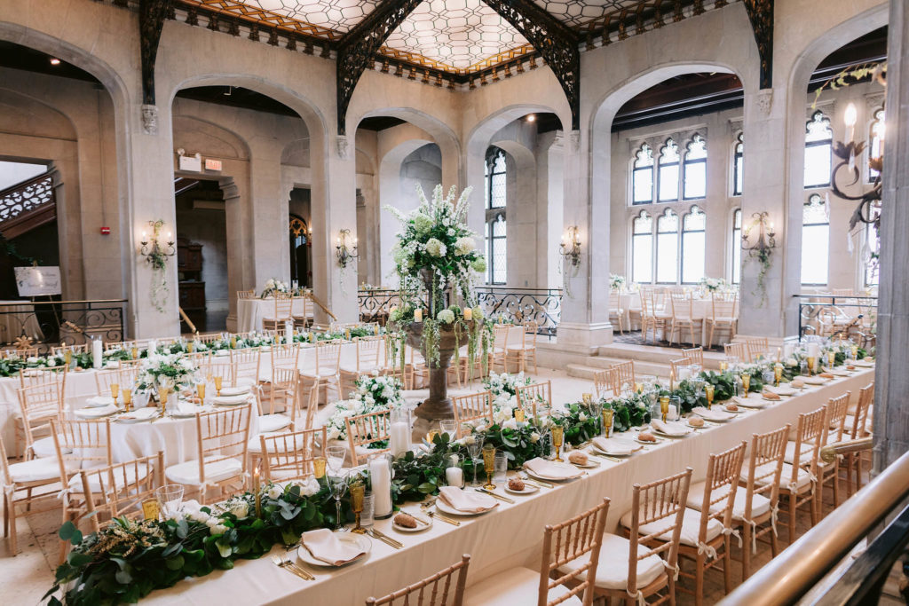 Jenny Fu Studio captures the opulent reception venue at Castle Gould in new York showcases high ceilings, large windows and an elaborately-patterned sun roof