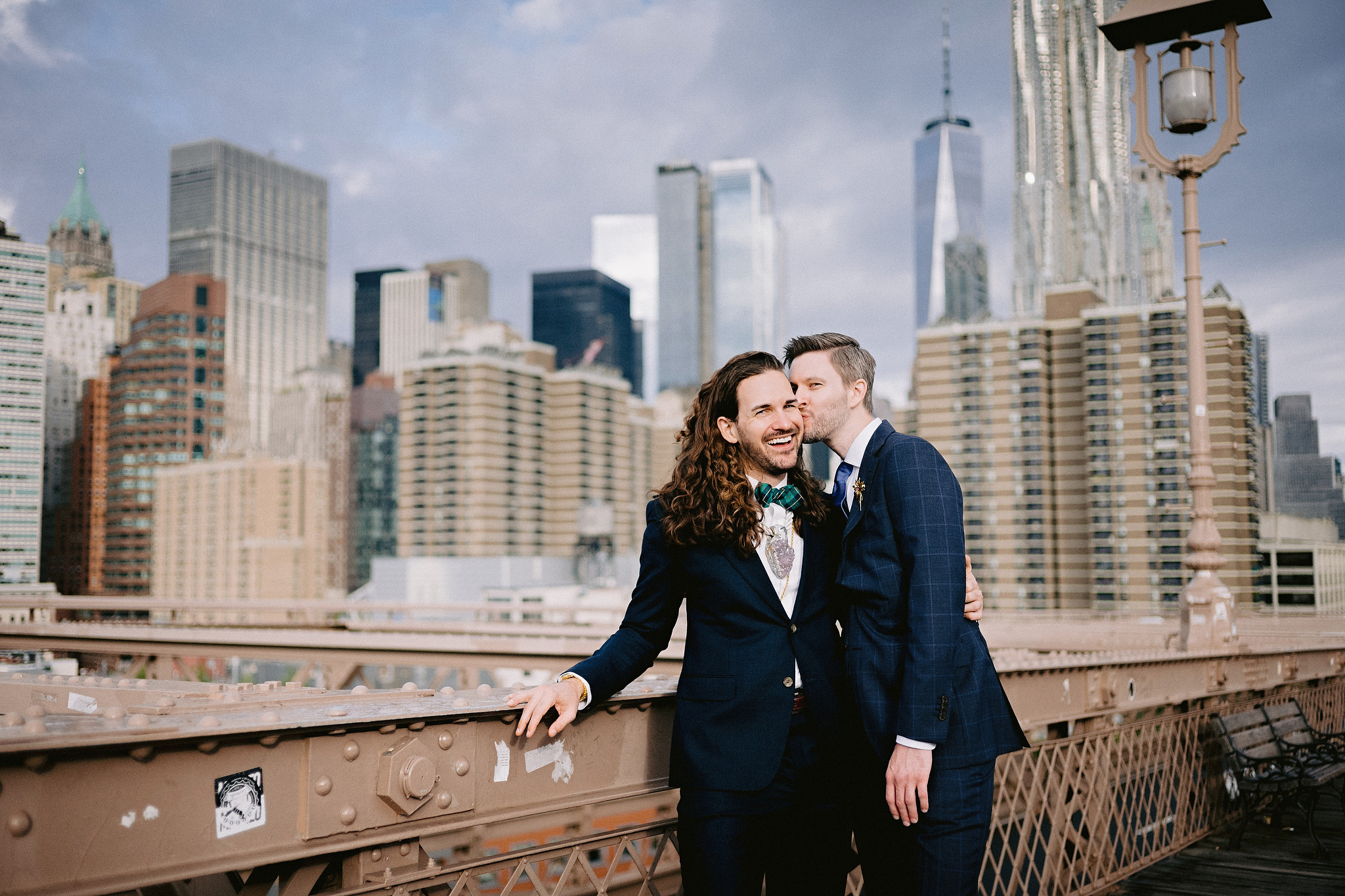 Husband and husband on the Brooklyn Bridge in New York City