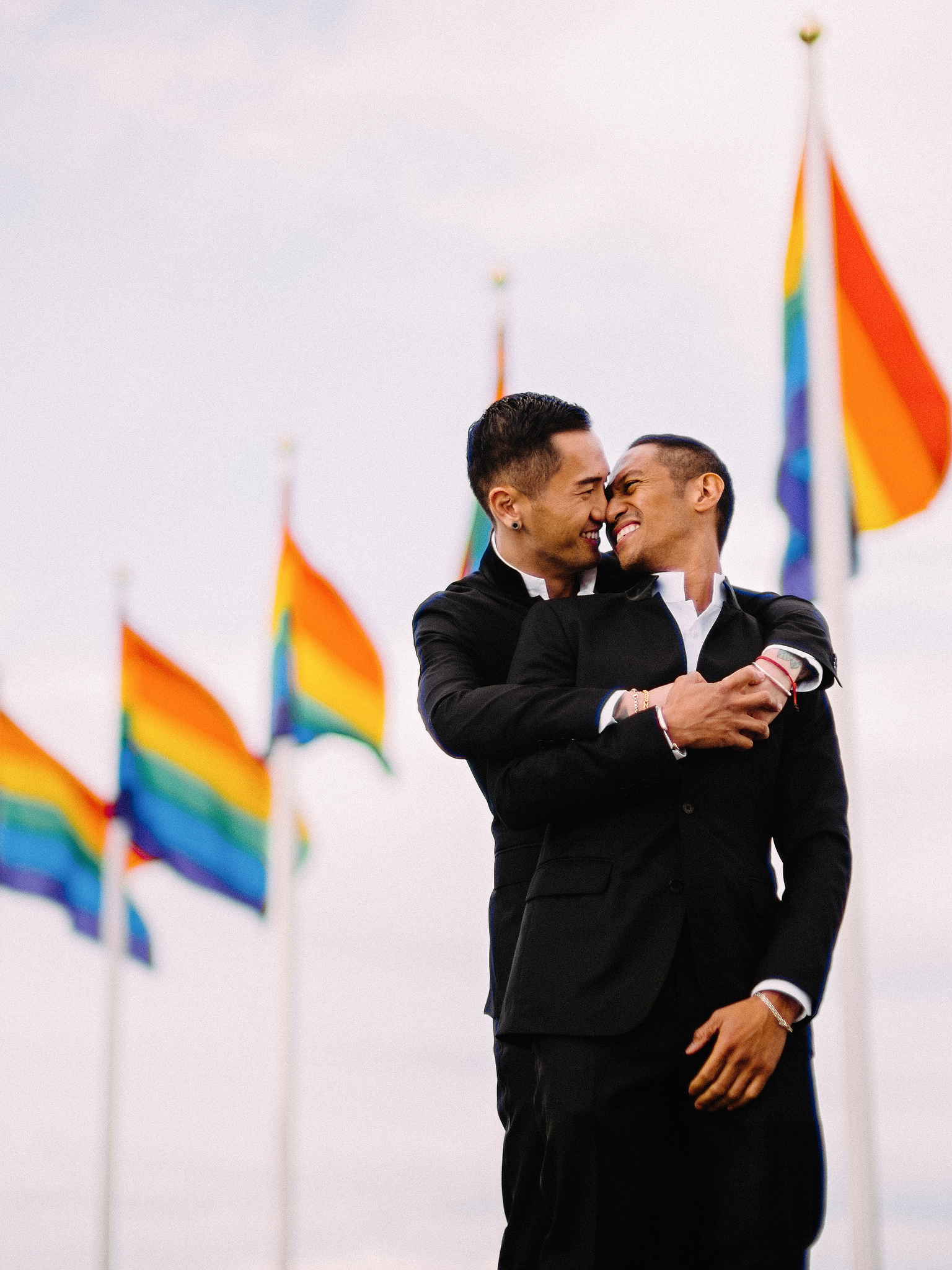 Husband and husband with rainbow flags in Reykjavik, Iceland