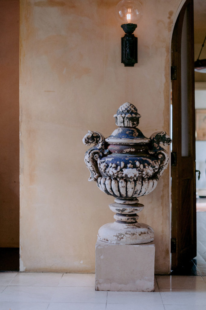 Large urn shaped statue in hallway