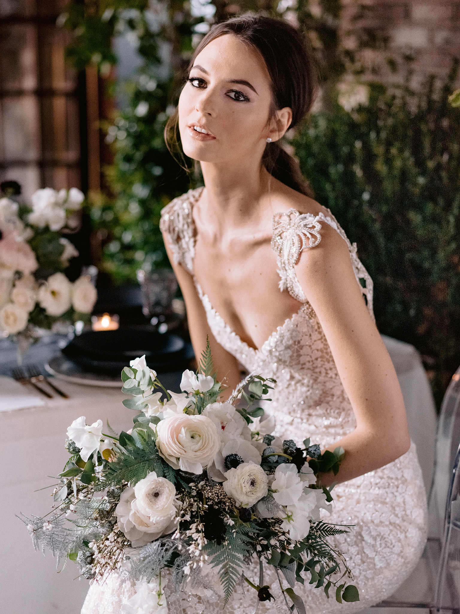 Chic bride with delicate white wedding bouquet