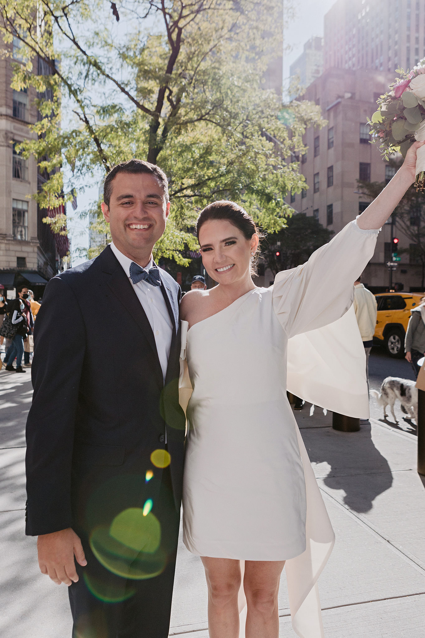 Newlyweds excited and happy after a beautiful ceremony at St. Patrick's cathedral in NYC