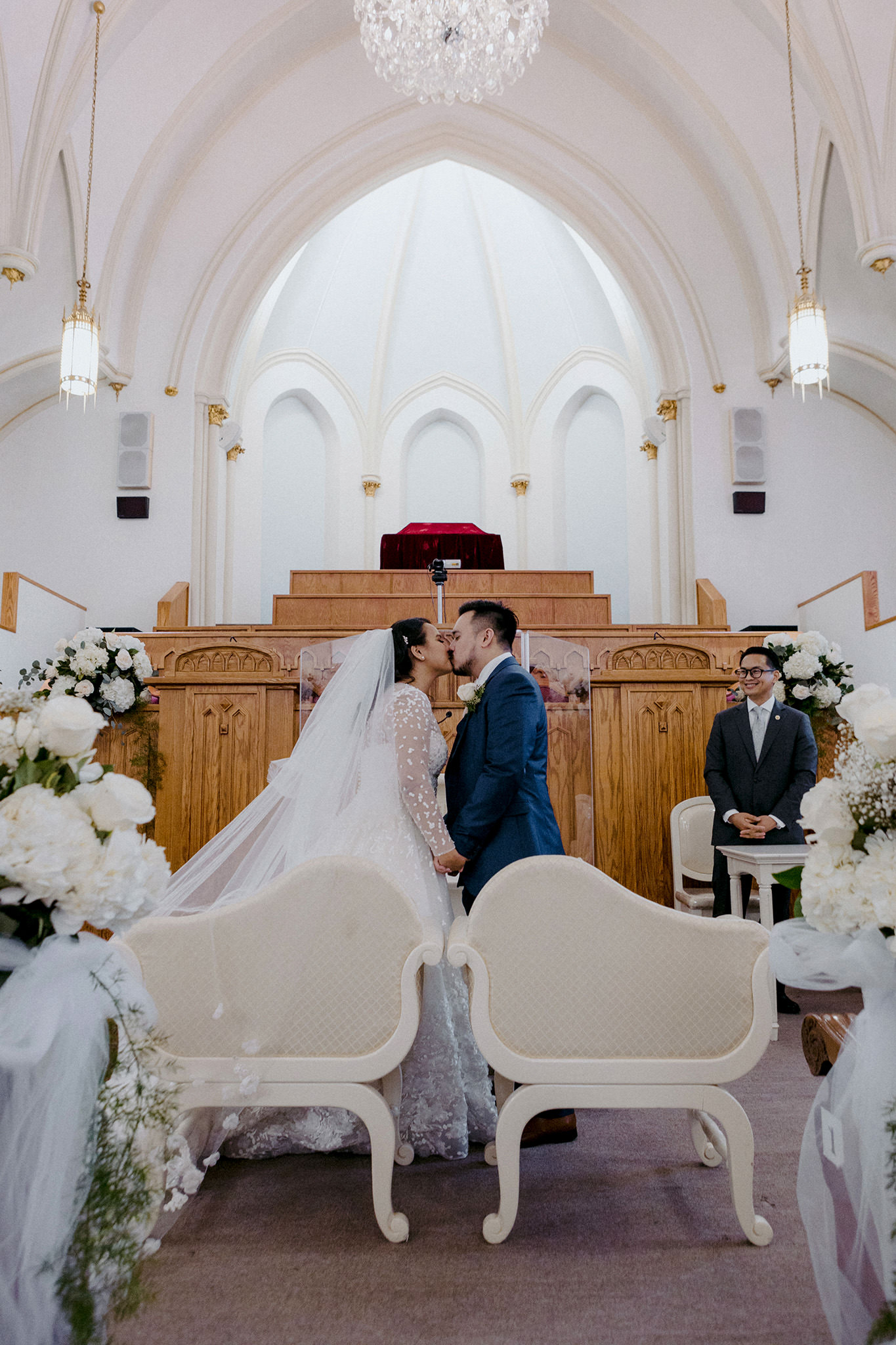 Bride and groom share their first kiss as husband and wife 