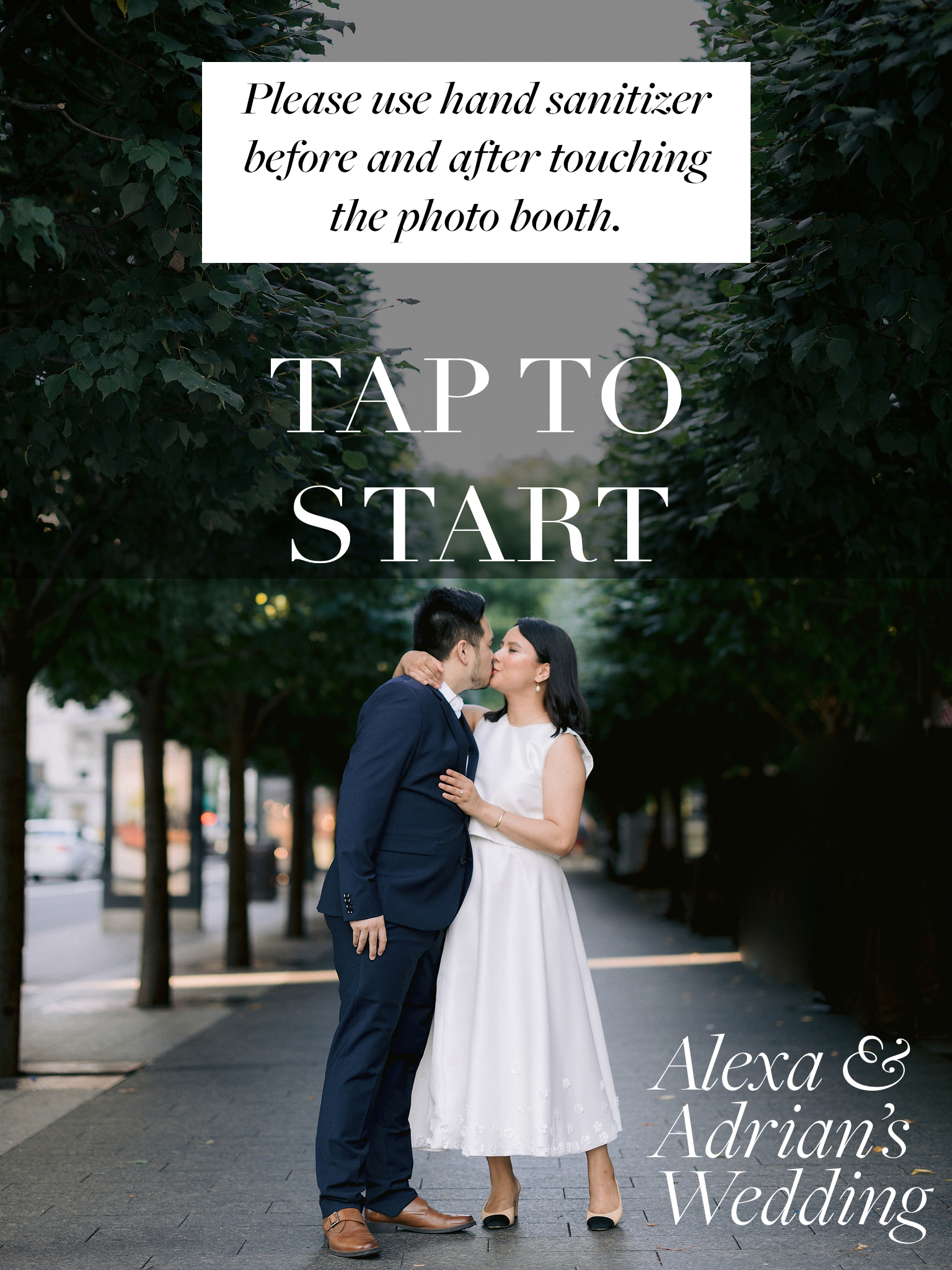 A digital wedding photo booth screensaver promoting sanitizing hands.