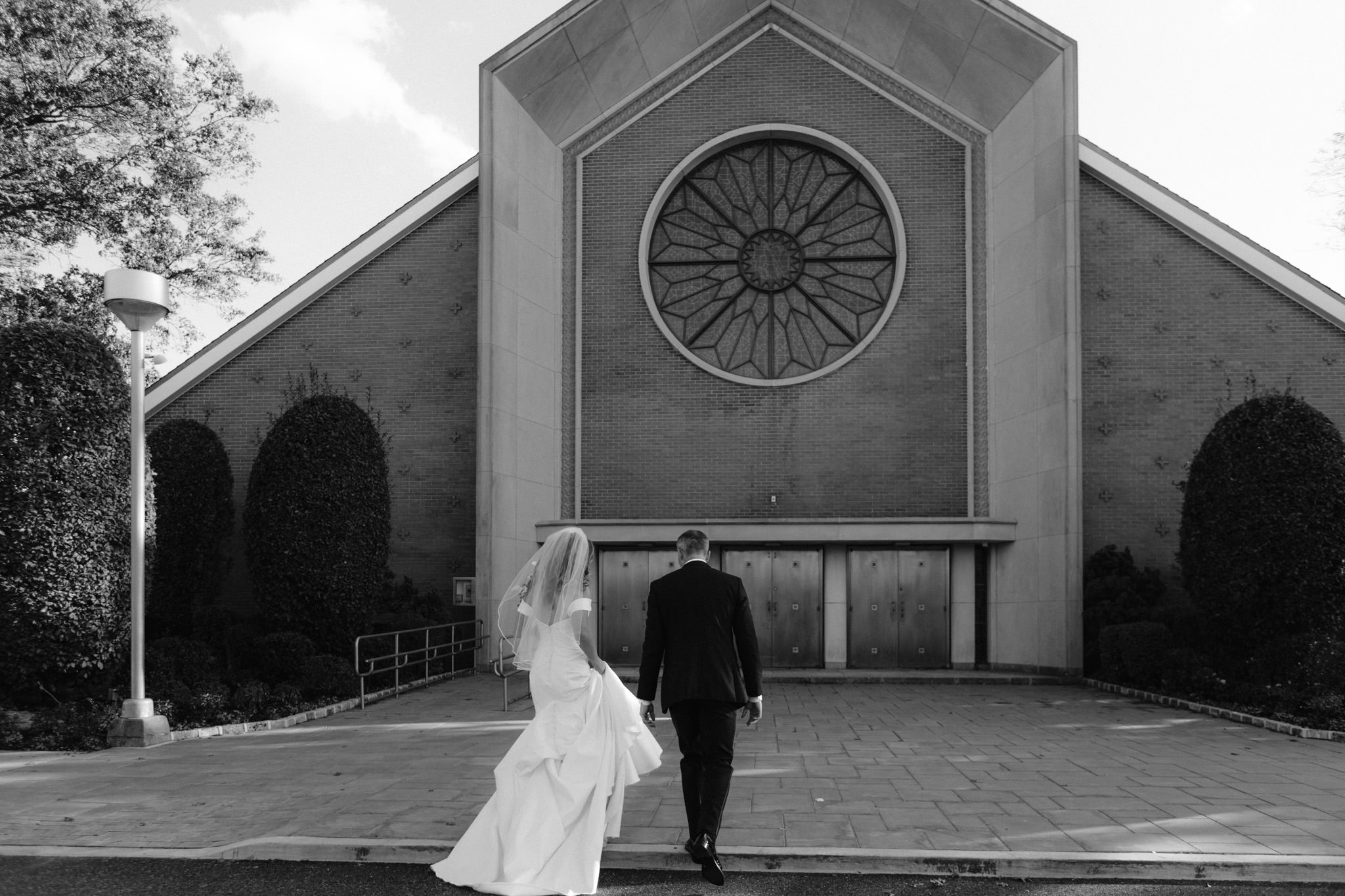 Bride and groom entering their church in Long Island