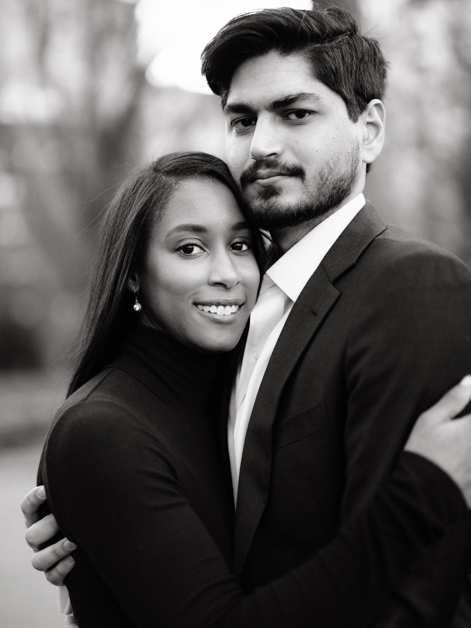 Bi-racial couple recalling their proposal in Washington Square Park at their engagement shoot