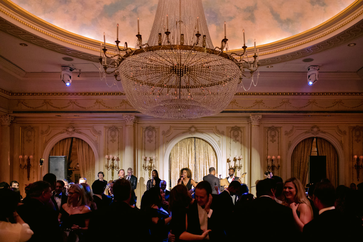 A live band singing at a wedding in NYC during wedding photos