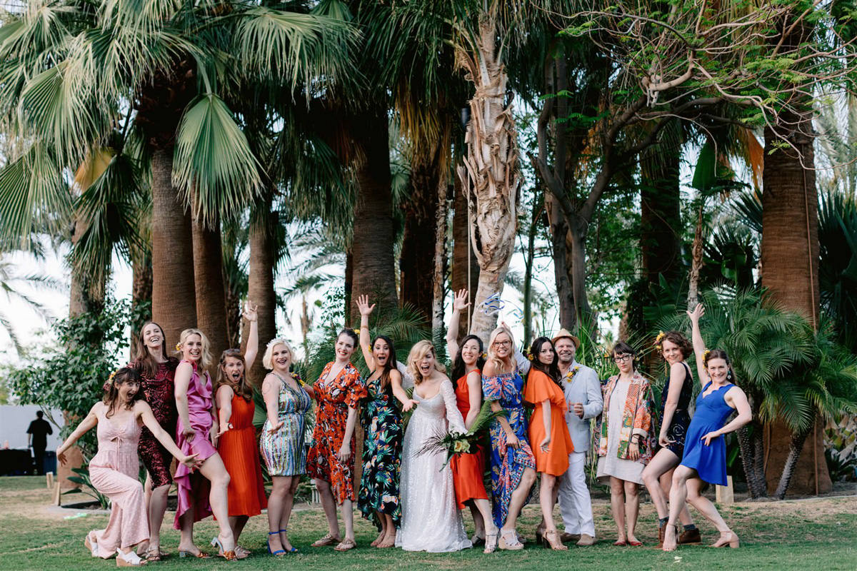 A bride and her wedding party pose for professional wedding photography