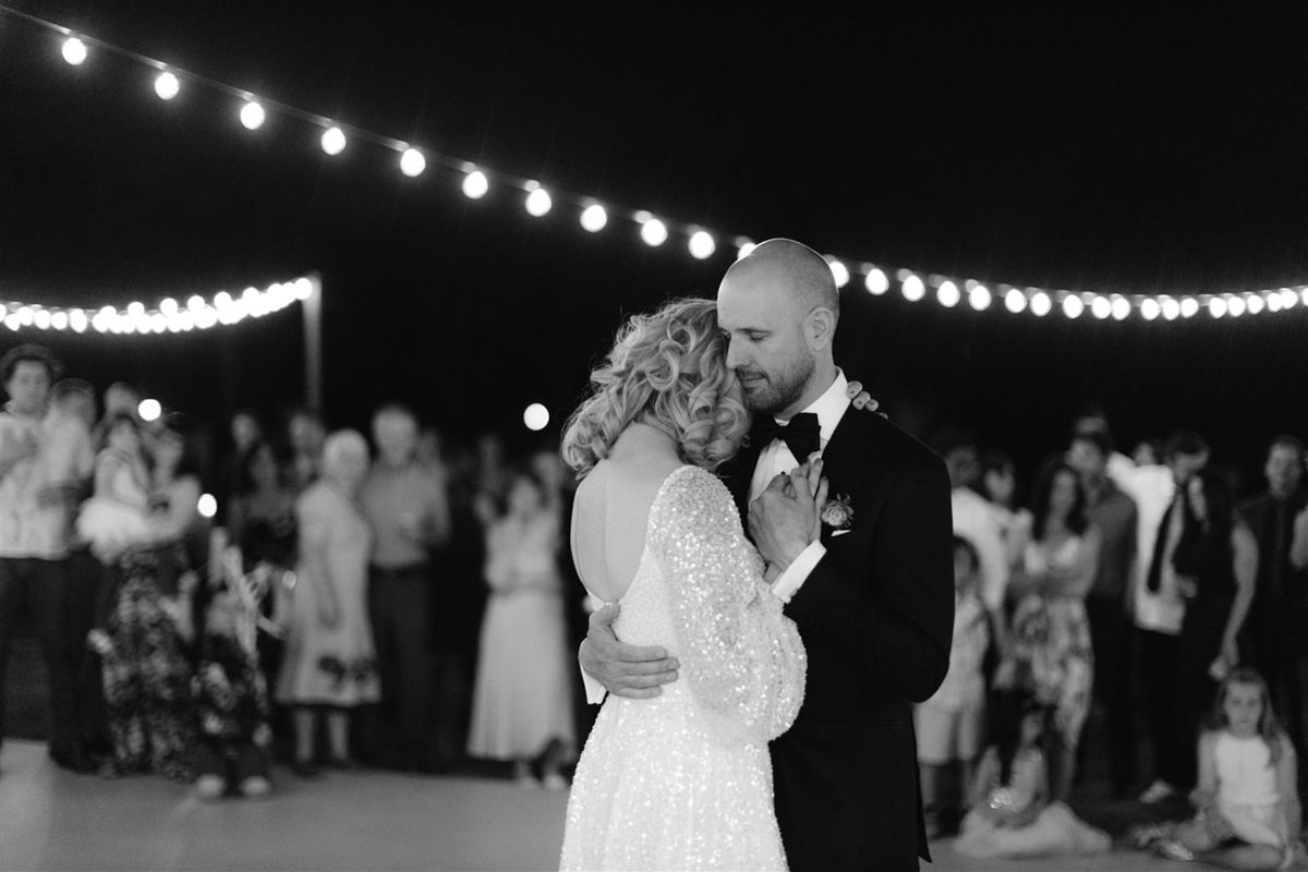 Bride and groom in an embrace on the dance floor at their wedding in Palm Springs
