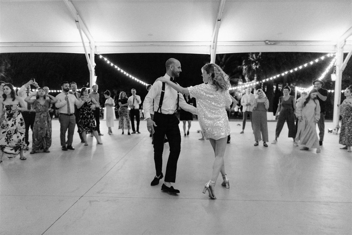 A bride and her groom dancing at their wedding