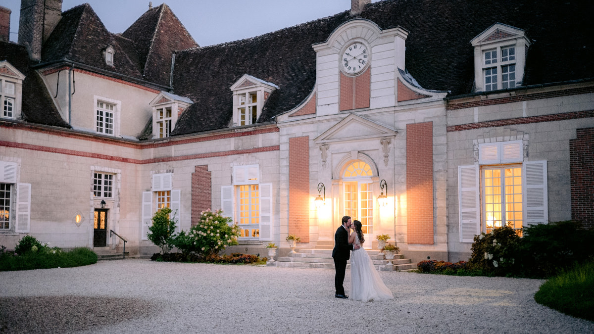 Bride and groom kiss at their destination wedding in France
| Wedding Planner for Destination Wedding