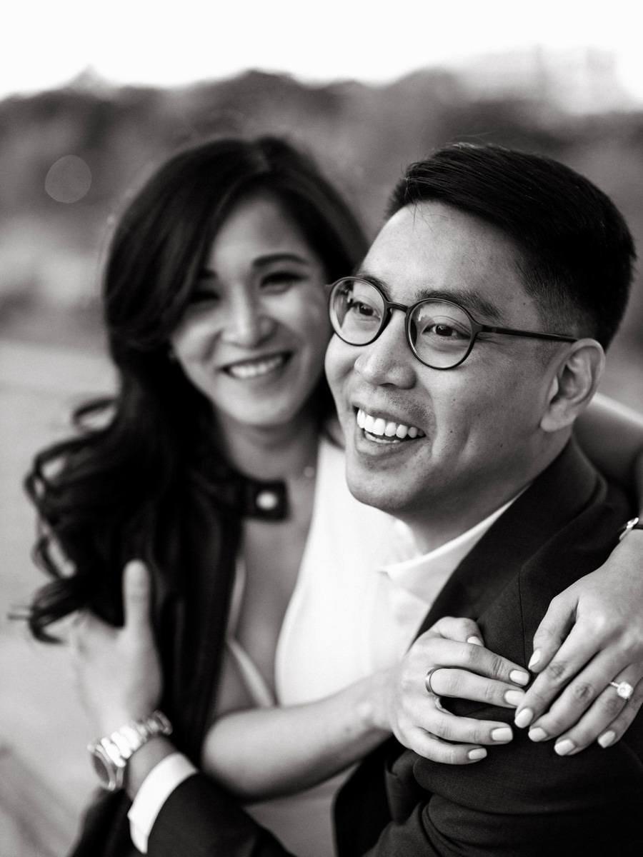 The engaged couple are happily hugging each other in New York; Engagement photo by Jenny Fu Studio