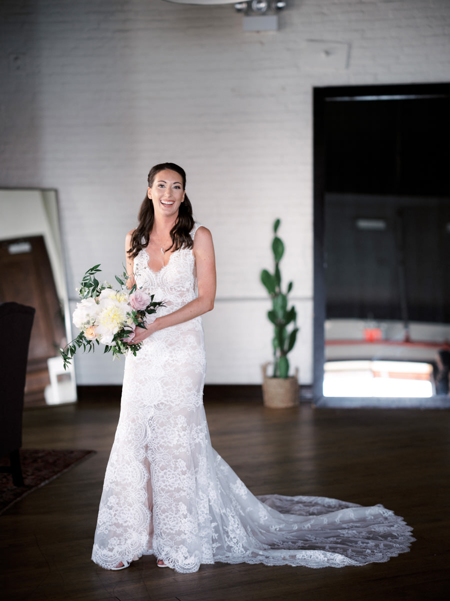 Bride in a white lace wedding dress