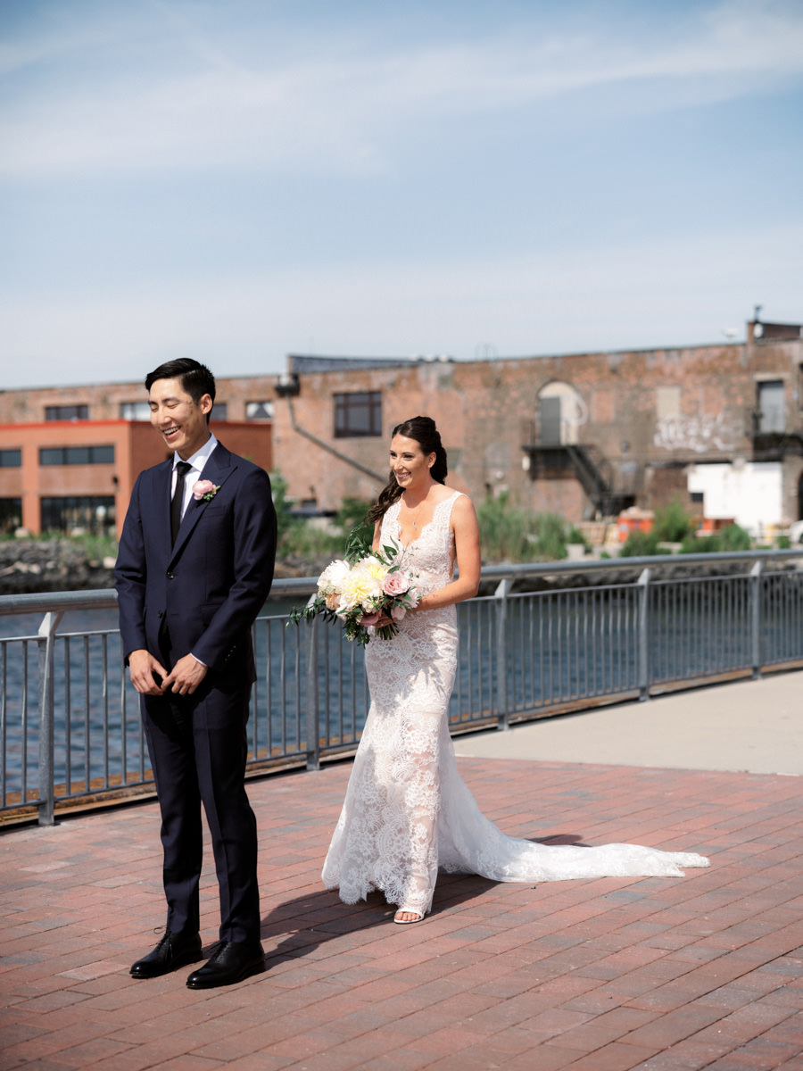 A bride surprises her groom with on a pier in New York City