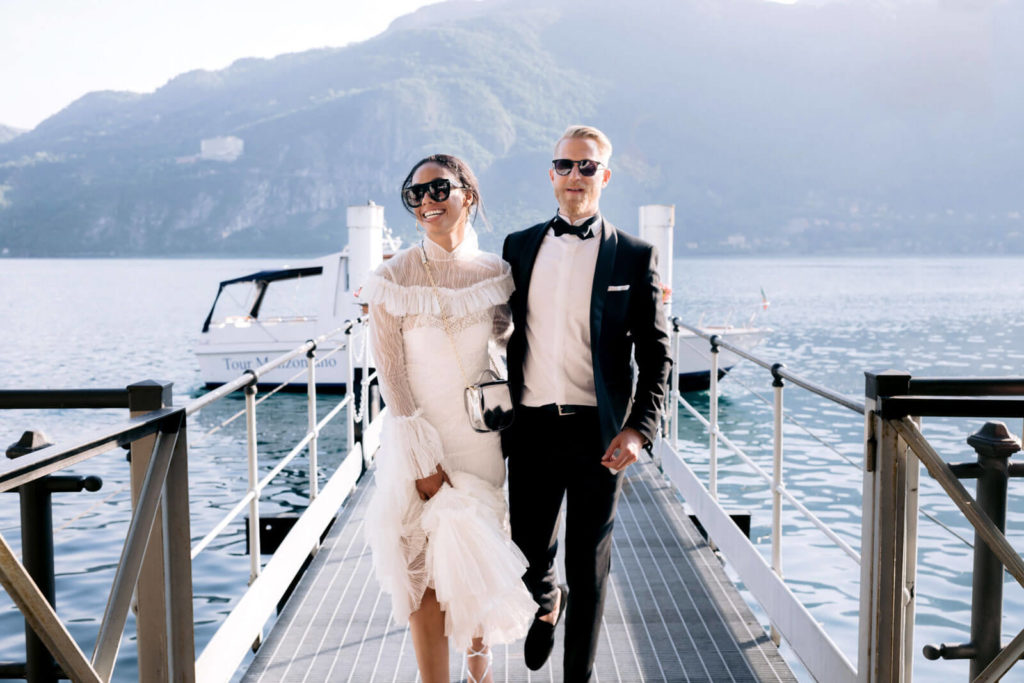 bride and groom return from cocktail cruise on Lake Como on wedding day