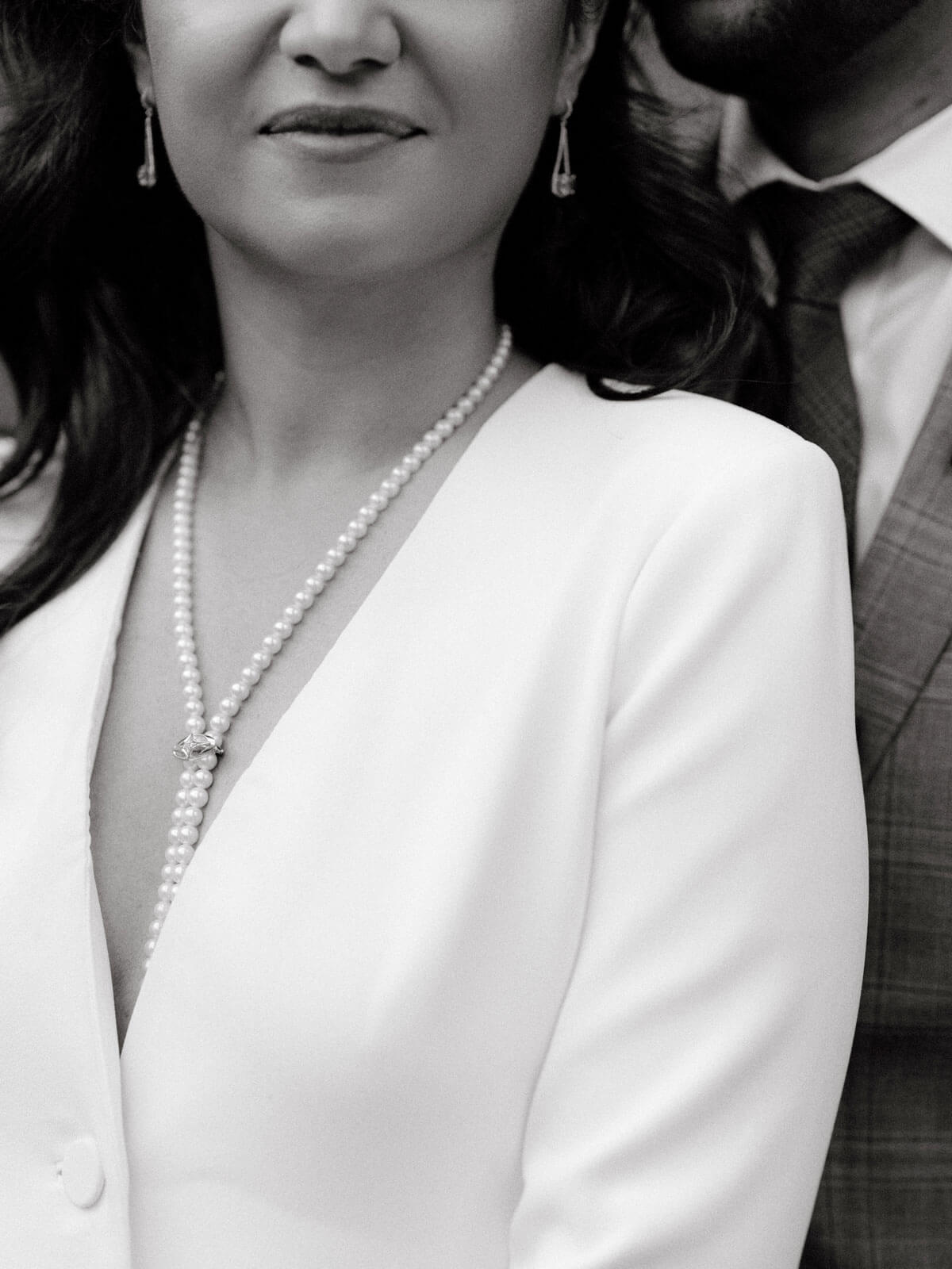 Black and white, Close-up shot of the bride's pearl necklace.