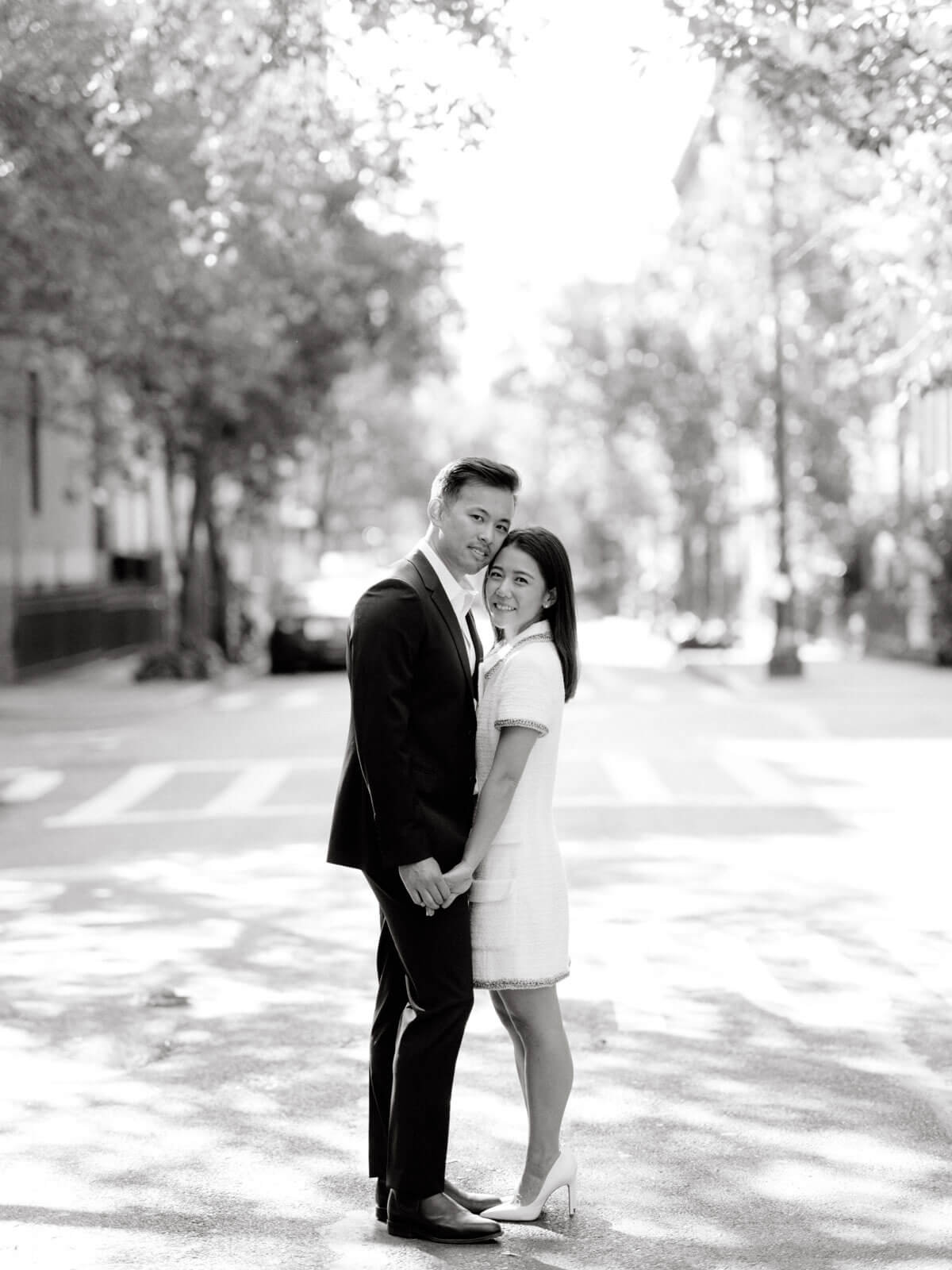 The engaged couple is in the middle of a street in West Village, NYC. Image by Jenny Fu Studio