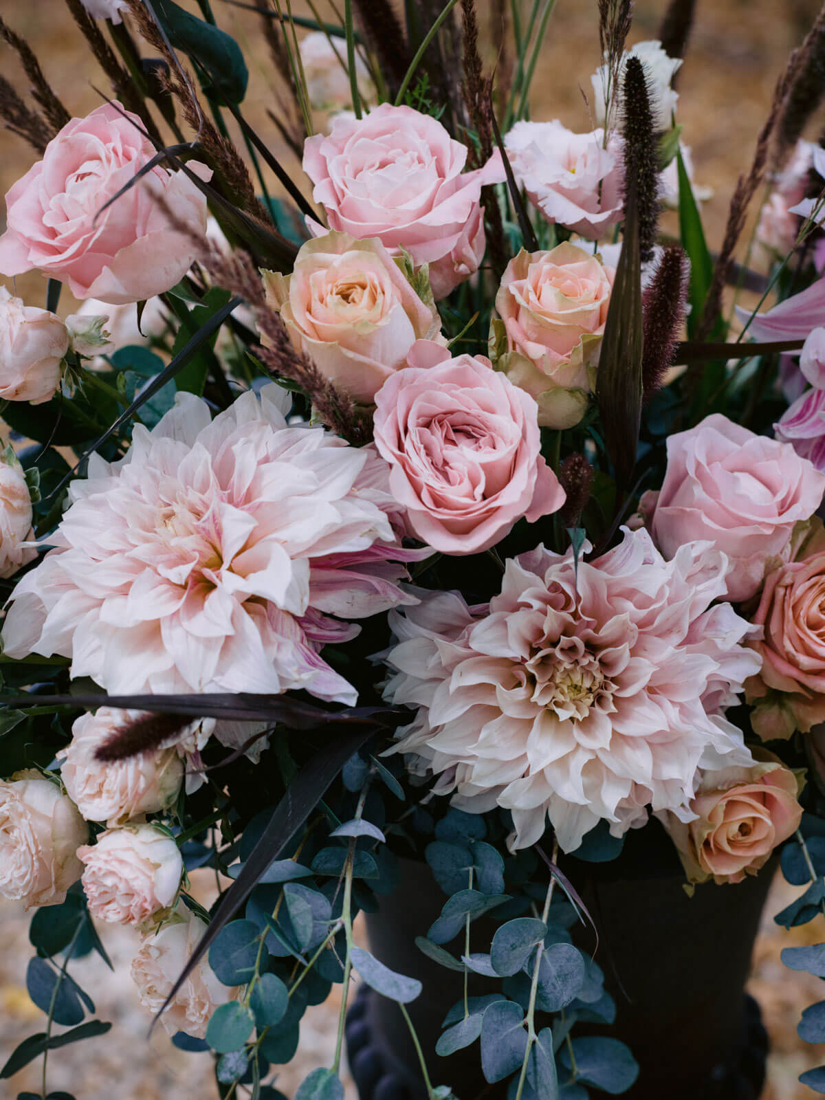 A mix of baby pink, pale orange, and white flowers for a France wedding. Image by Destination Wedding Photographer Jenny Fu