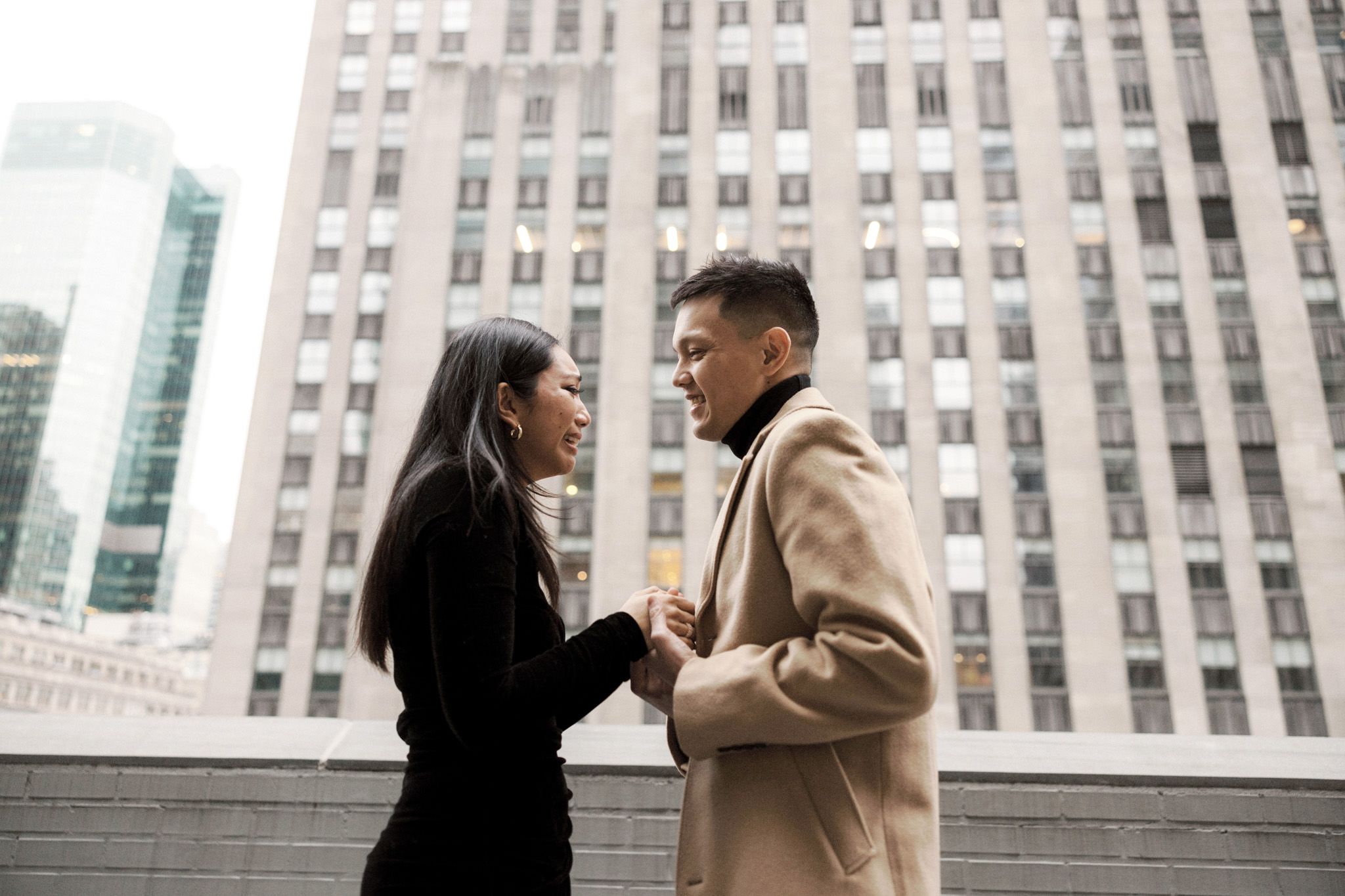 The woman is emotional as her partner proposed to her in NYC. Engagement image by Jenny Fu Studio