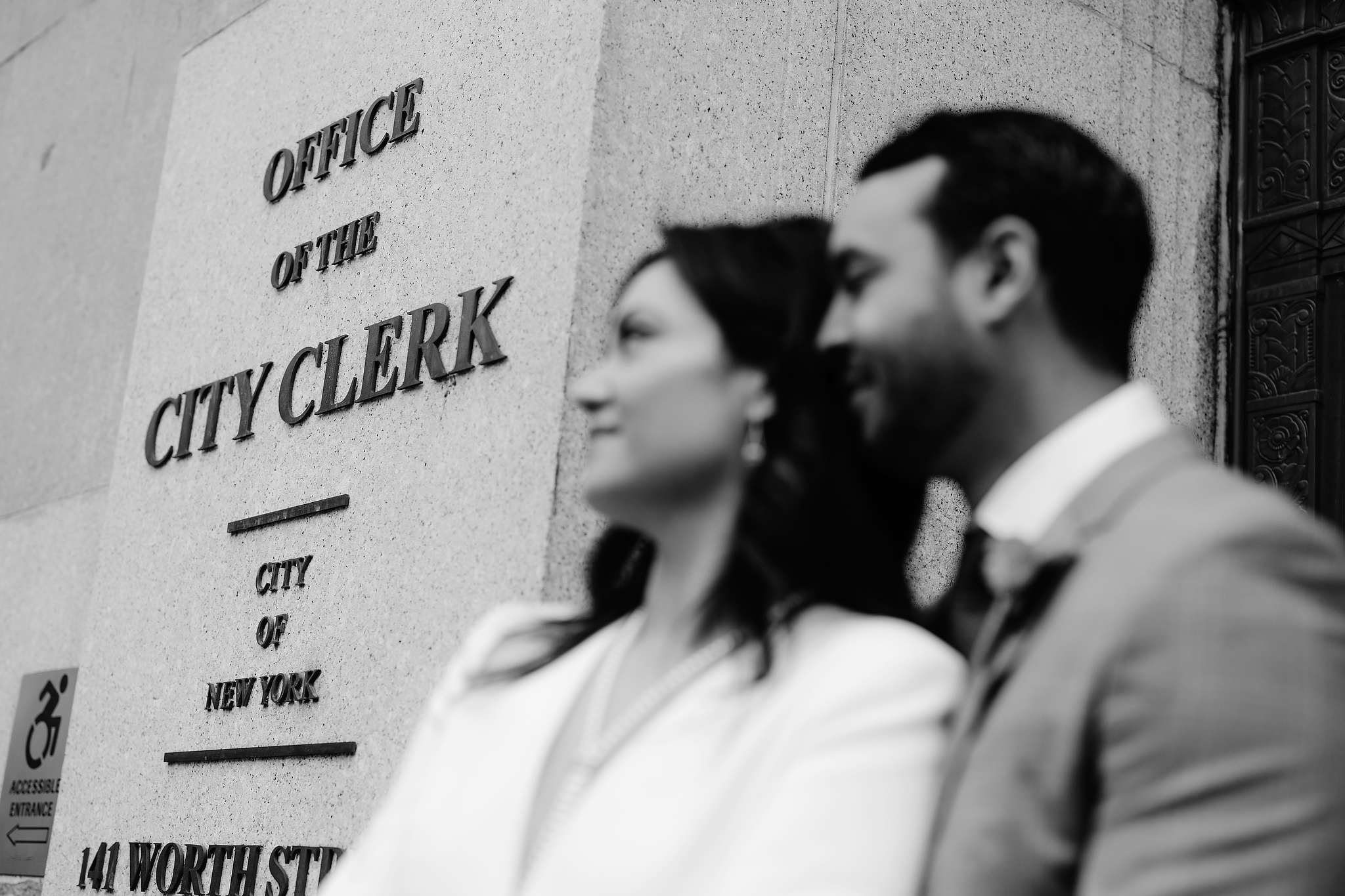 The bride and groom is outside of the Office of the City Clerk to have their 2022 NYC City Hall wedding. Image by Jenny Fu Studio