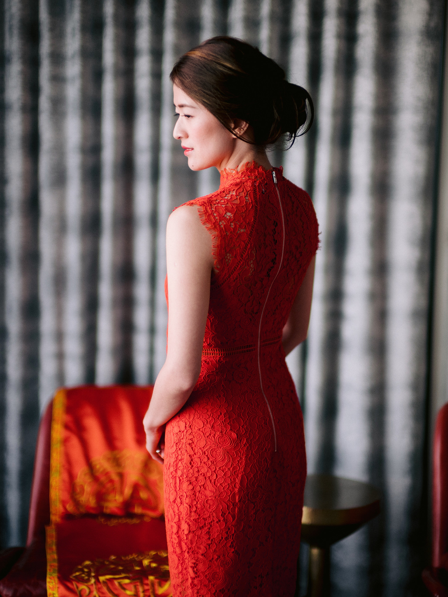 The bride is wearing a red wedding dress for a love month wedding. Image by Jenny Fu Studio