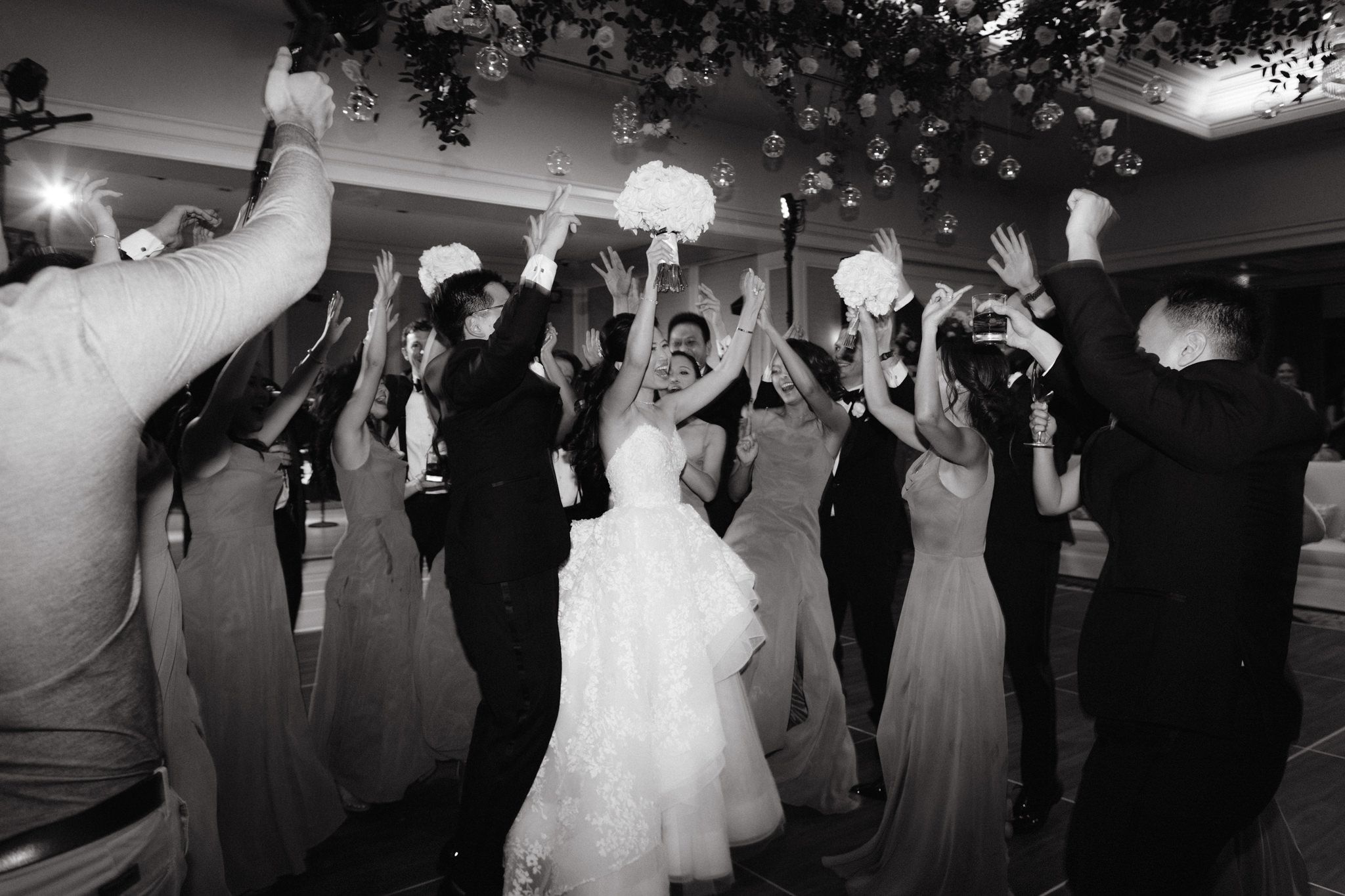 The bride, groom and guests are happily dancing the night away. Image by Jenny Fu Studio