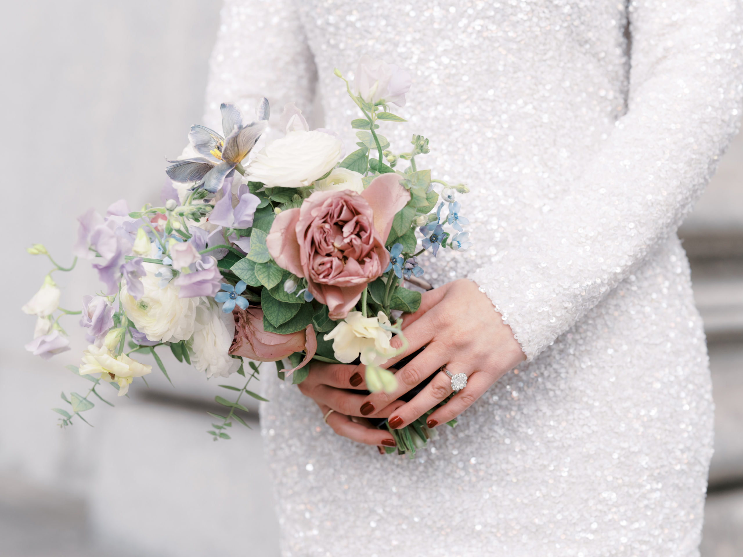 Beautiful flower bouquet in the bride's hands for her city hall elopement. Editorial wedding image by Jenny Fu Studio NYC
