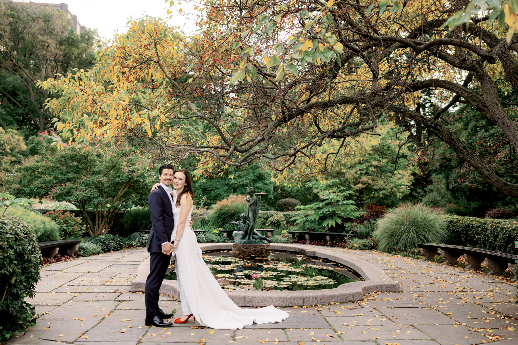 The bride and groom are standing in the middle of the lovely Conservatory Garden. Image by Jenny Fu Studio
