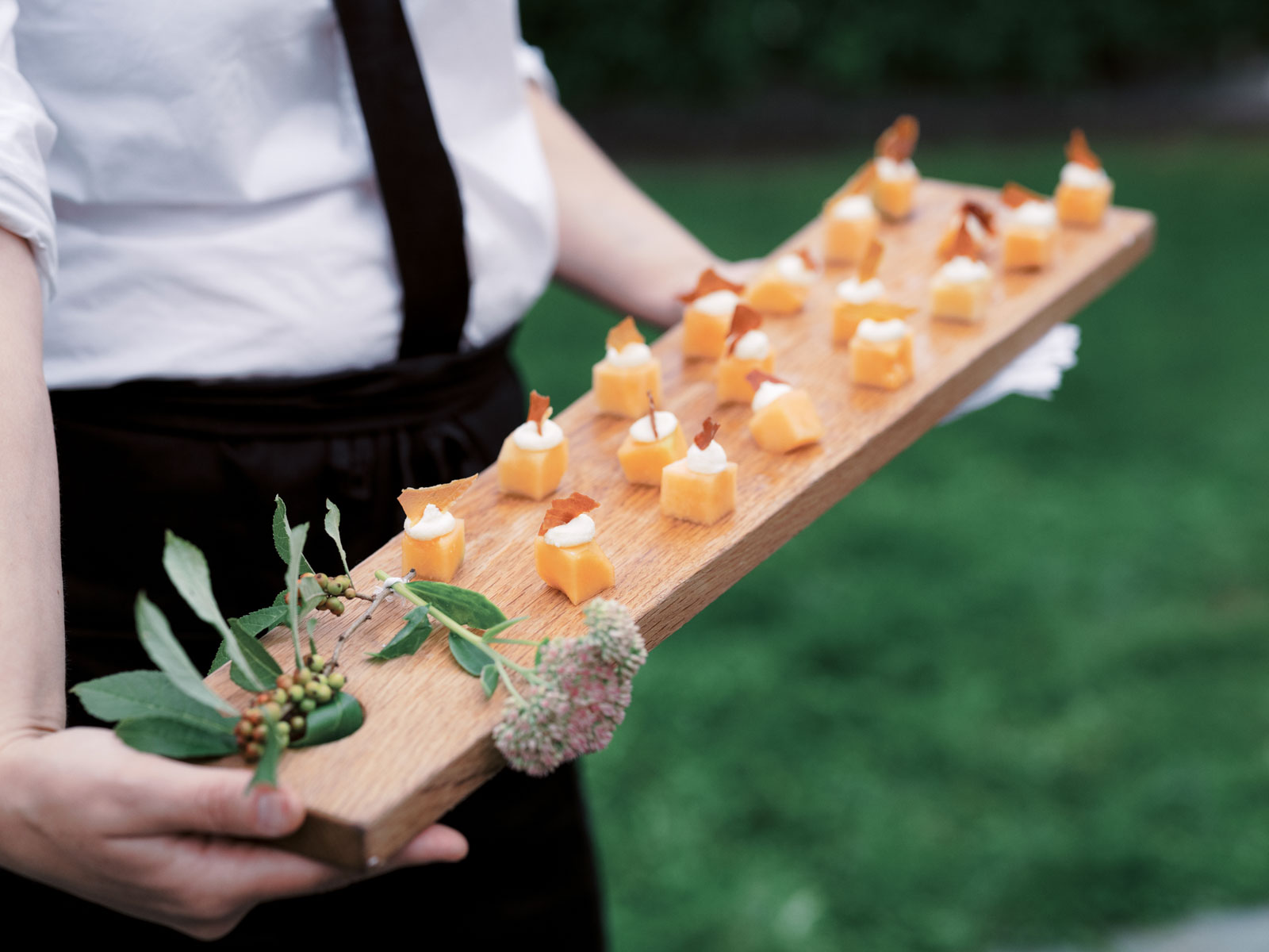 A plate of sashimi appetizer for a wedding at The Lion Rock Farm. Editorial wedding image by Jenny Fu Studio