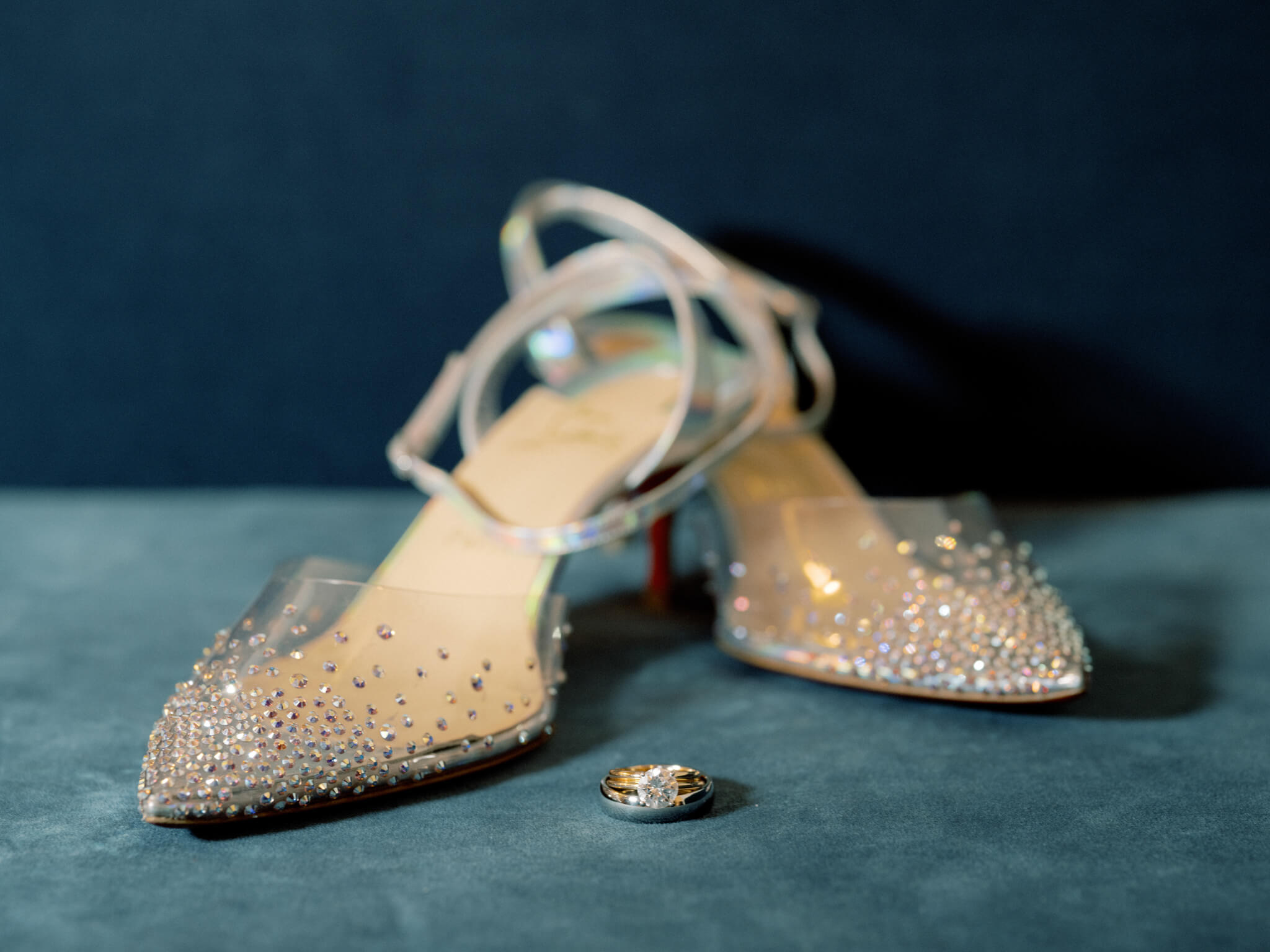 Editorial photo of the bride's wedding shoes by Christian Louboutin and engagement and wedding bands. Manatta wedding Image by Jenny Fu Studio NYC