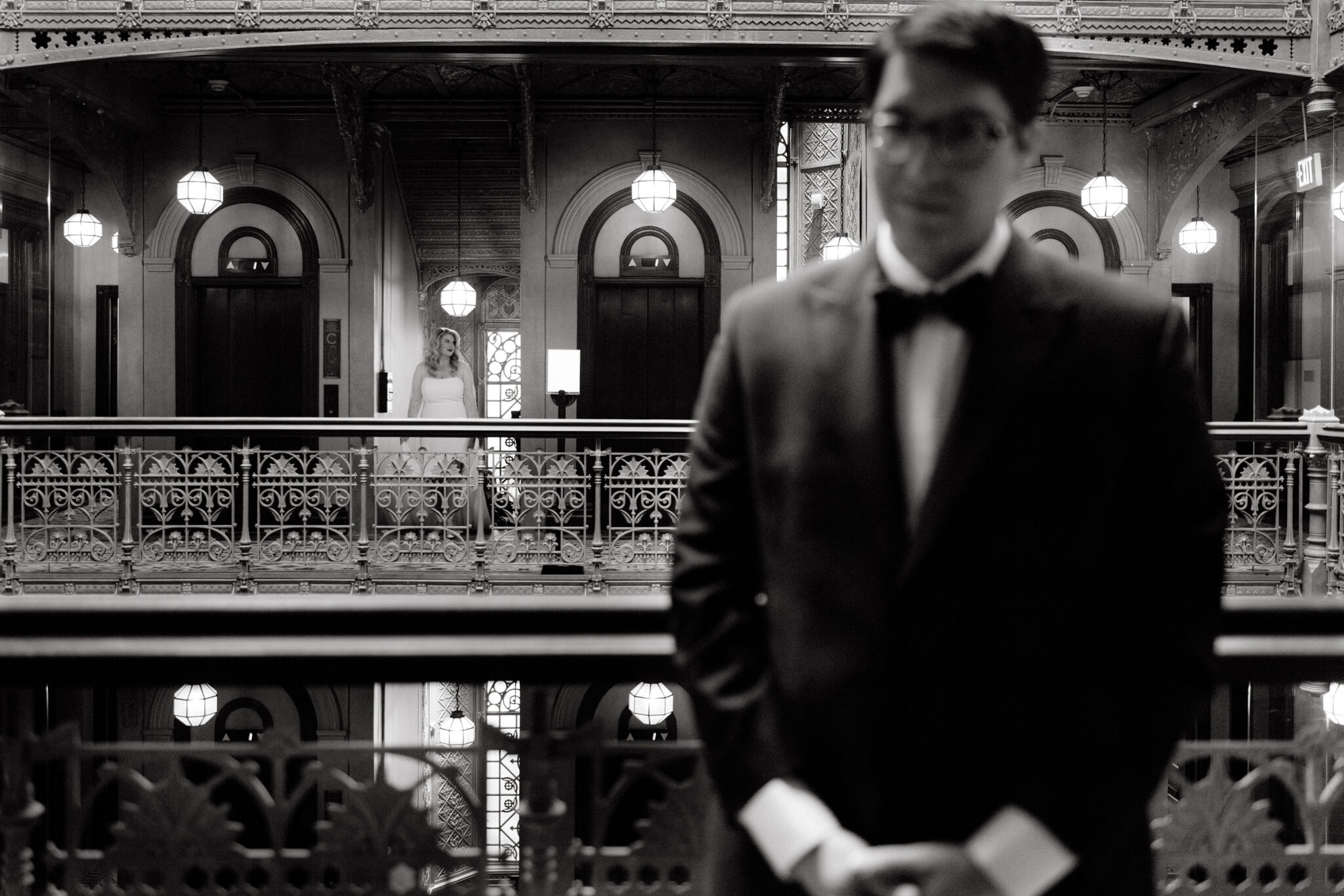 Black and white editorial First Look photo of the bride and groom at The Beekman Hotel, NYC. Image by Jenny Fu studio
