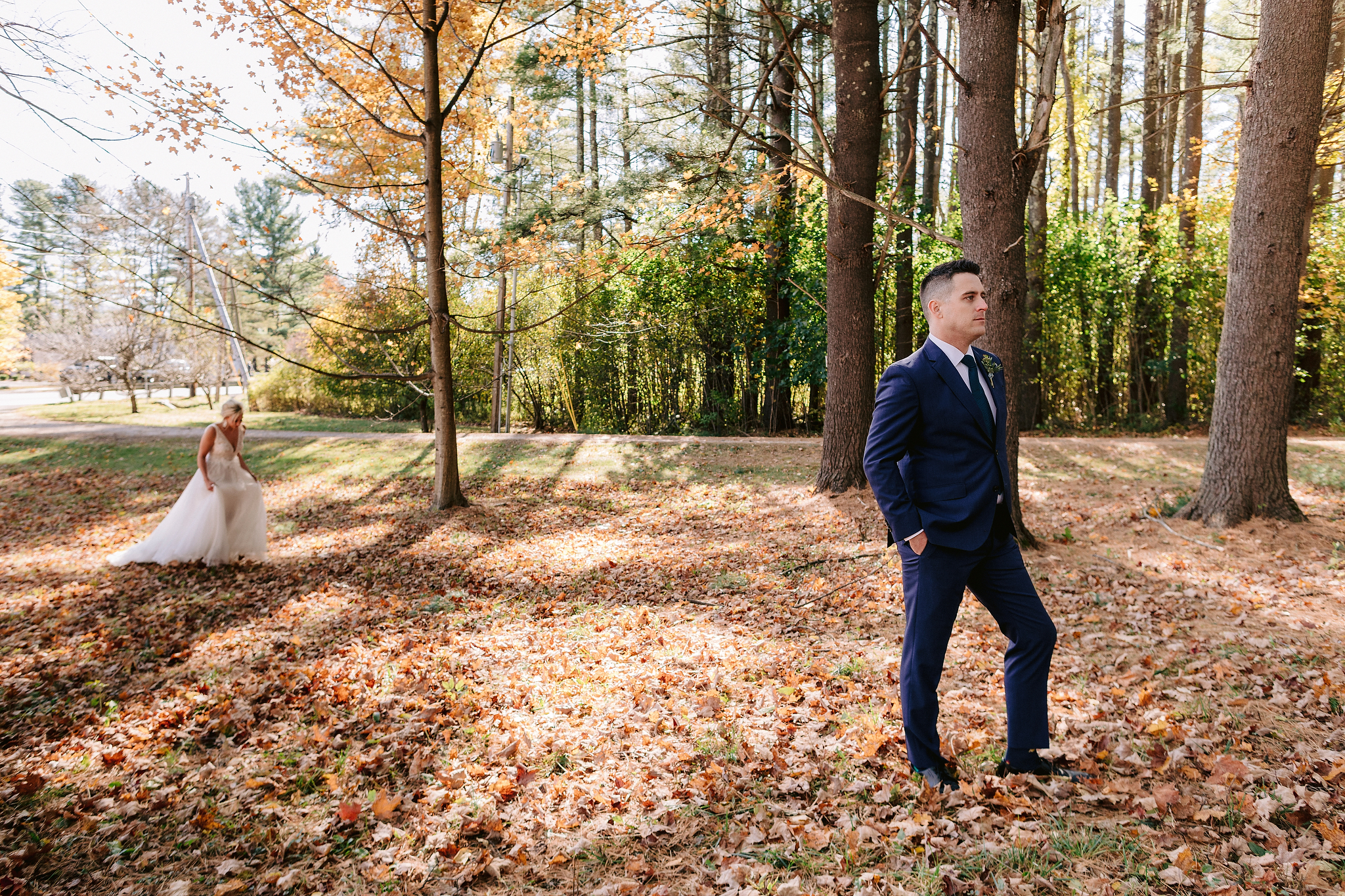 The bride and groom are posing for their First Look photo with beautiful nature in the background. Editorial destination wedding image by Jenny Fu Studio.