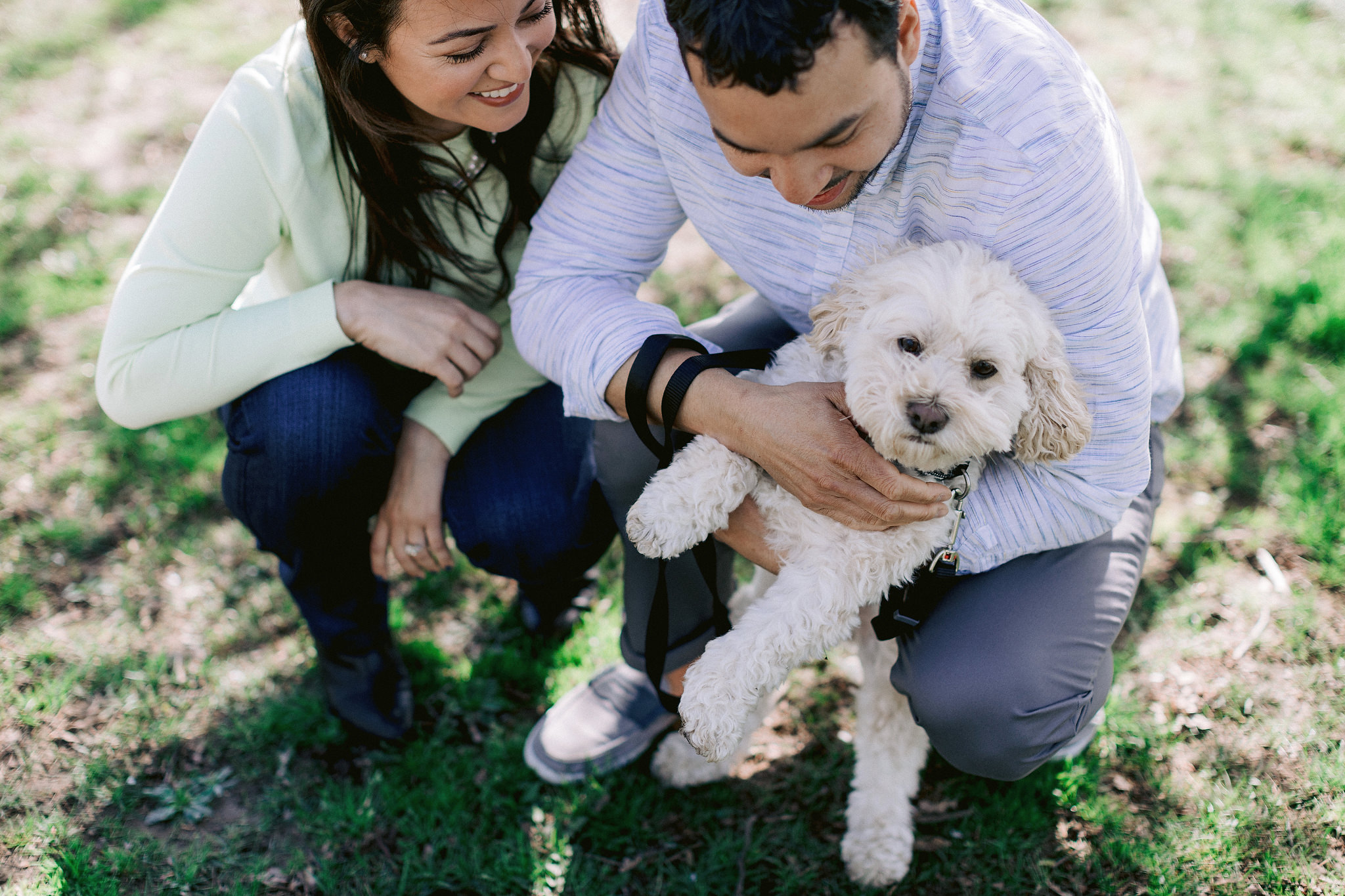 Best NY engagement spots with your dogs. The engaged couple is cuddling their dog. Image by Jenny Fu Stuio