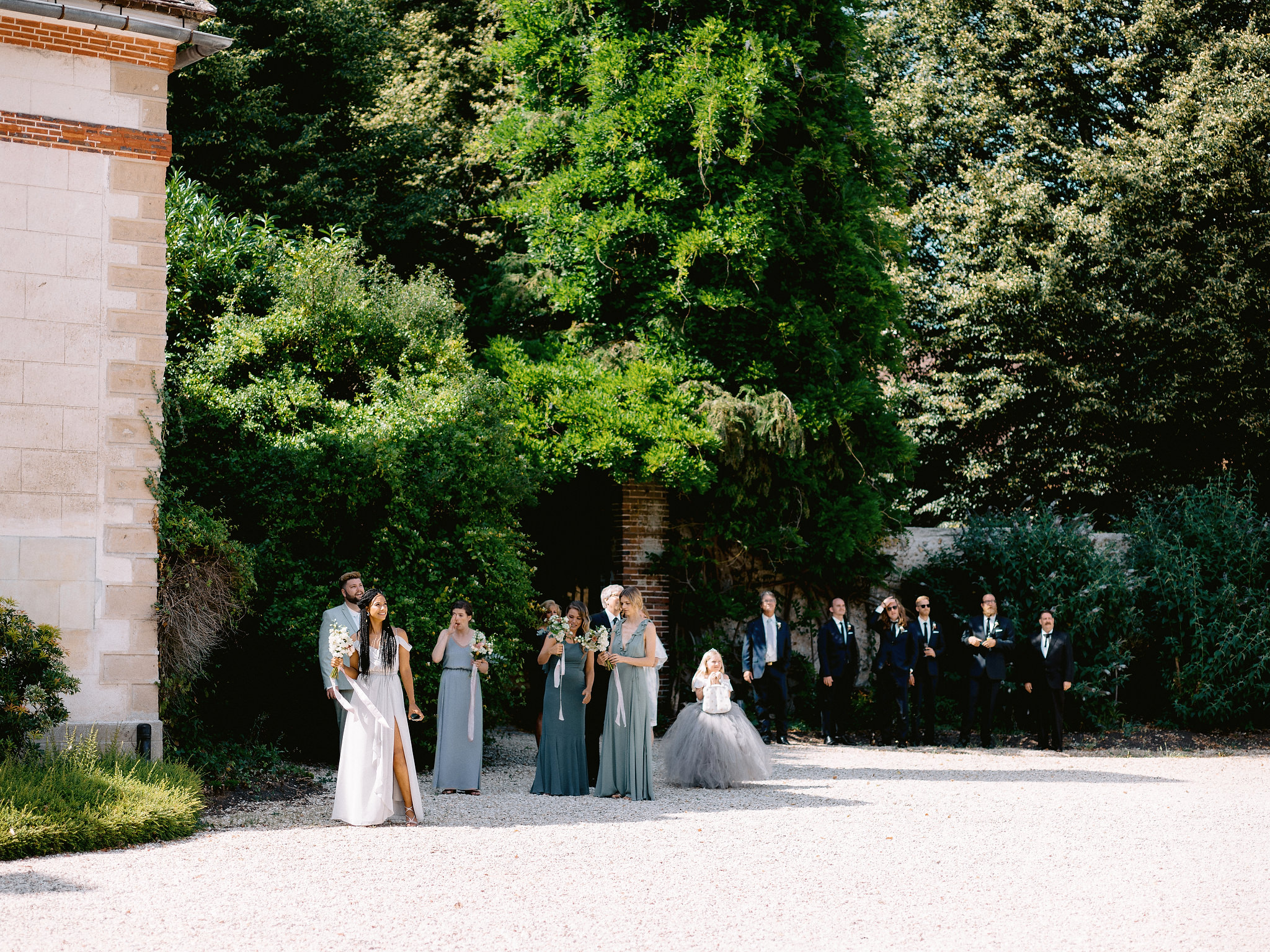 Editorial image of the wedding party waiting for the wedding ceremony to start. European destination wedding venue image by Jenny Fu Studio