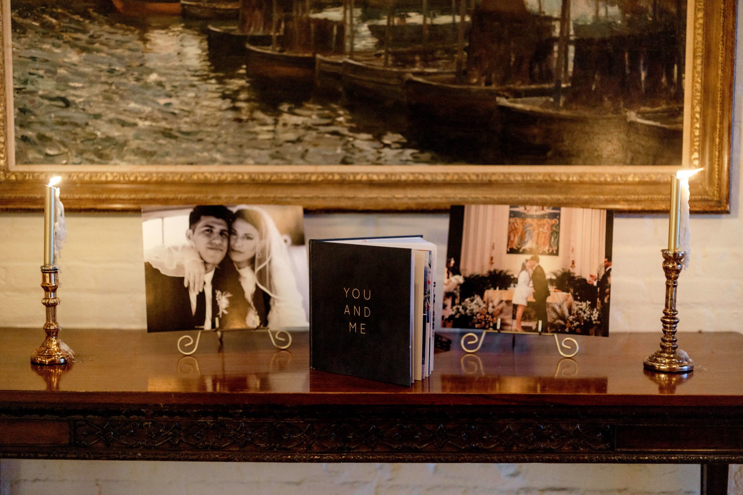A side table is decorated with the couple's engagement photos. Editorial engagement photo by Jenny Fu Studio