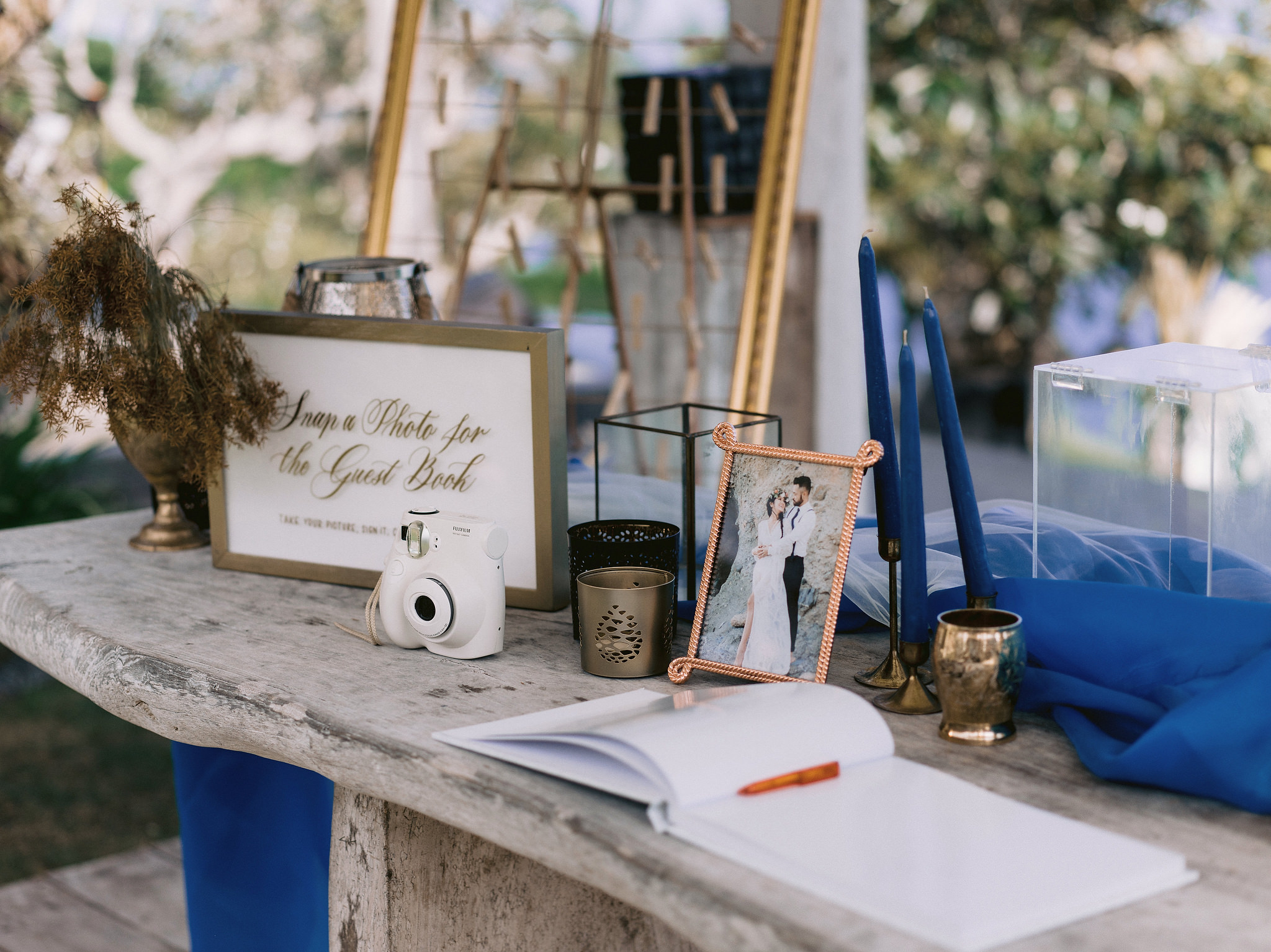 An elegant Guest book table with a framed engagement photo. Editorial engagement image by Jenny Fu Studio