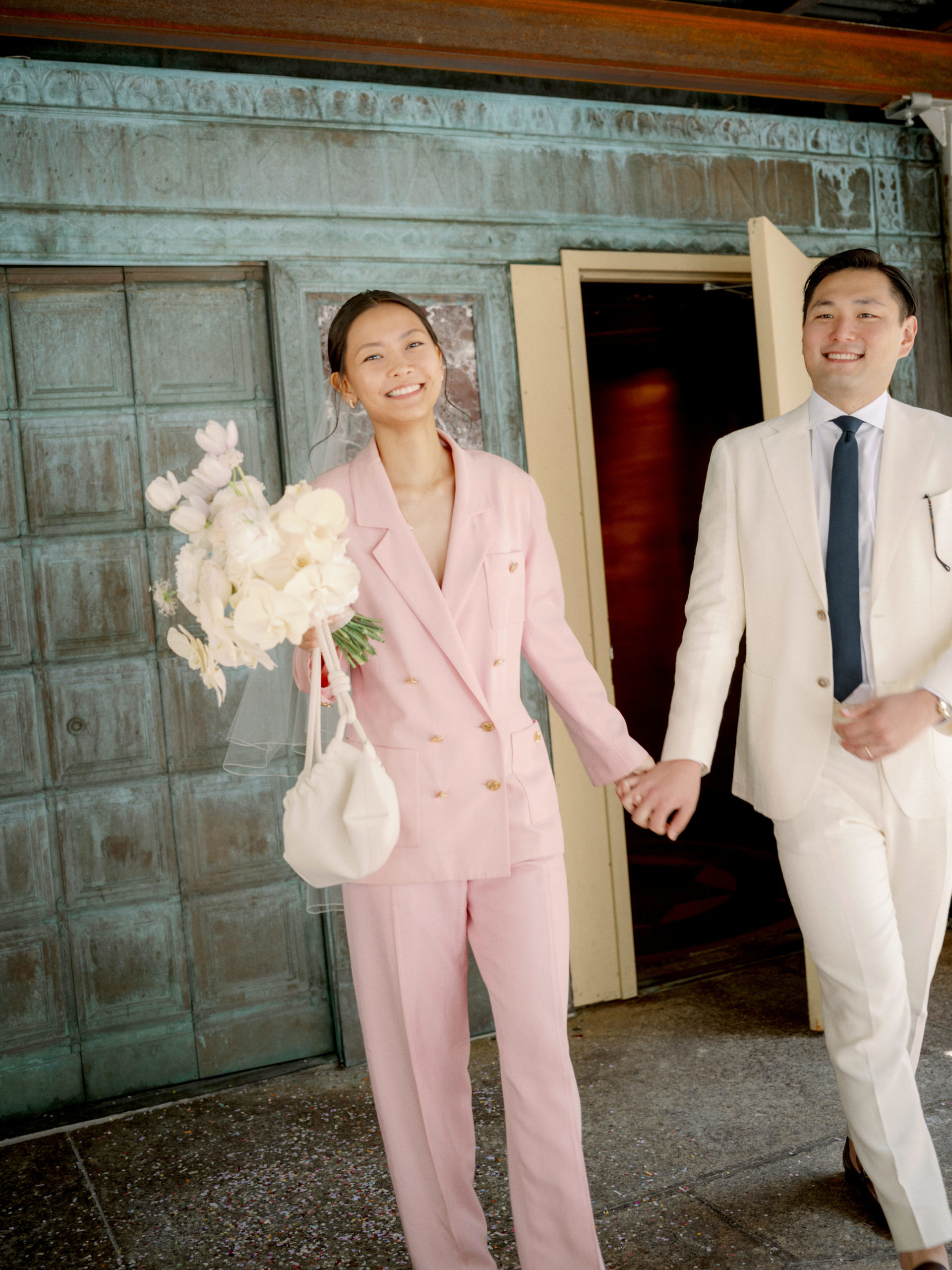 The newlyweds went out of the exit door at the NYC Marriage Bureau. Image by Jenny Fu Studio 