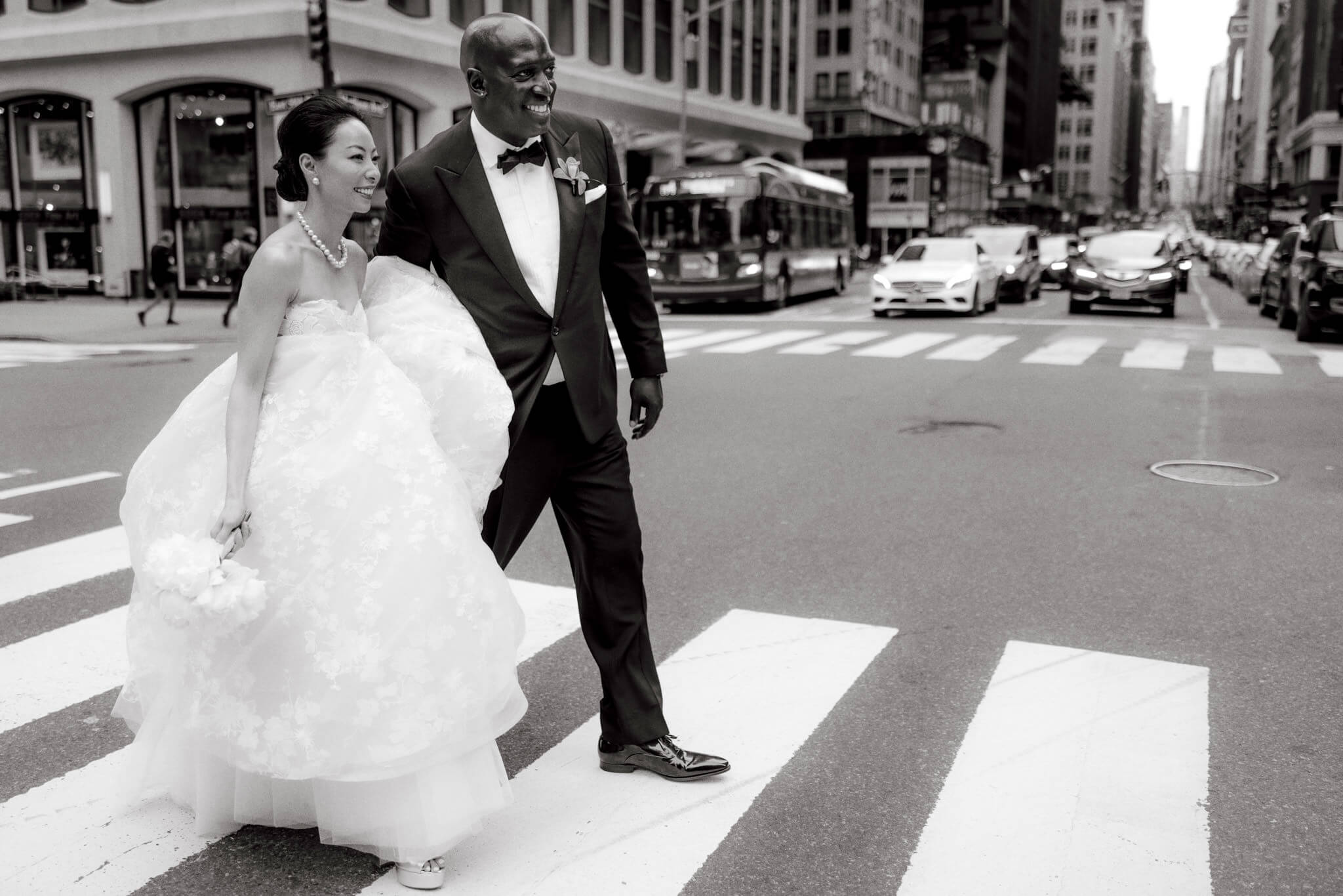 Editorial photo of the bride and groom crossing the streets of New York. Image by Jenny Fu Studio