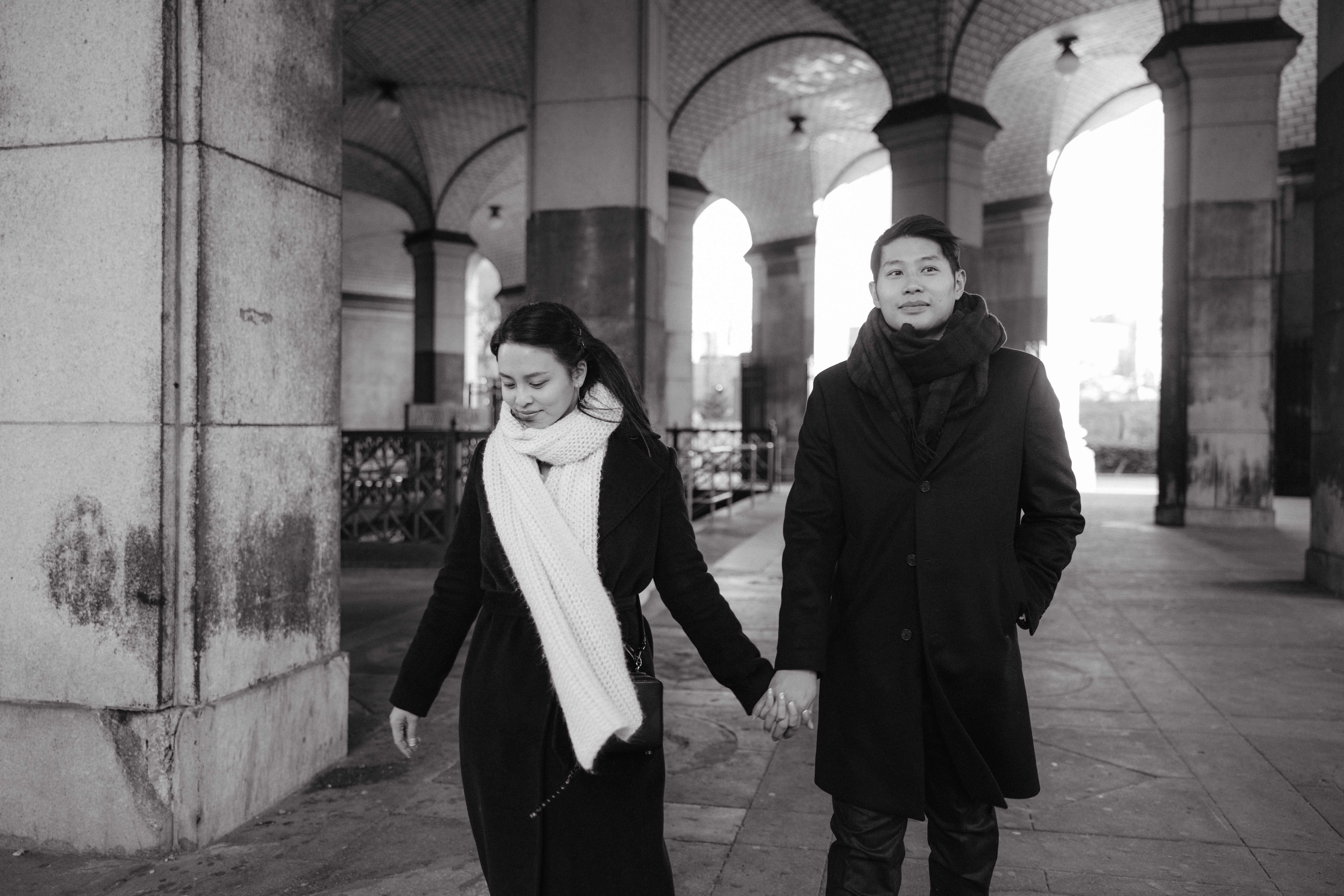 Black and white photo of the couple walking from a subway station. NYC City Hall wedding photos image by Jenny Fu Studio