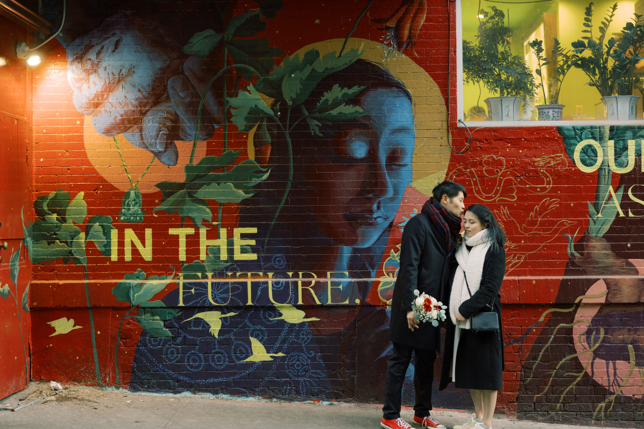 Editorial image of the newlyweds in front of a graffiti in New York. Image by Jenny Fu Studio