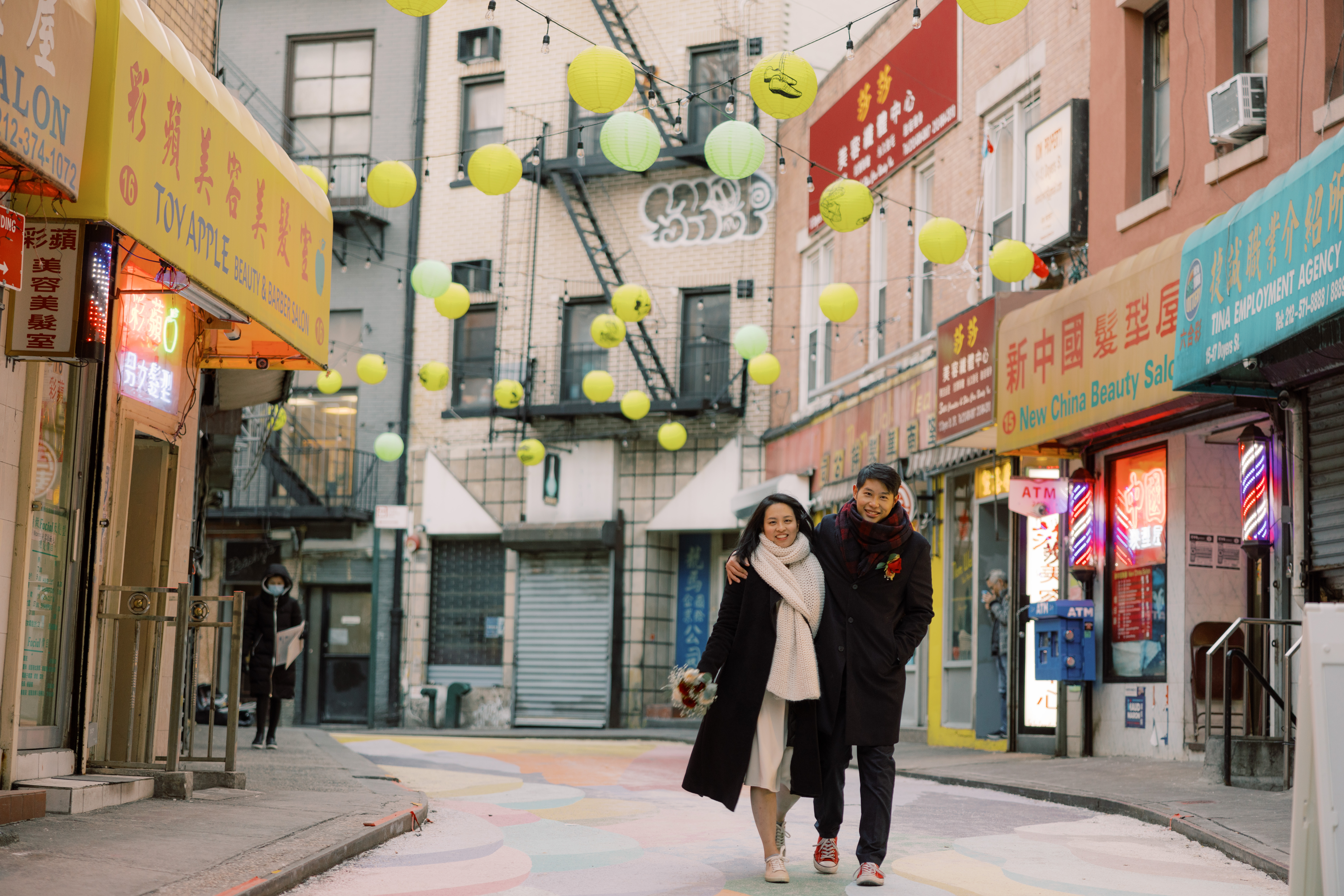 Editorial image of the newlyweds walking in Chinatown. NYC City Hall wedding photos image by Jenny Fu Studio